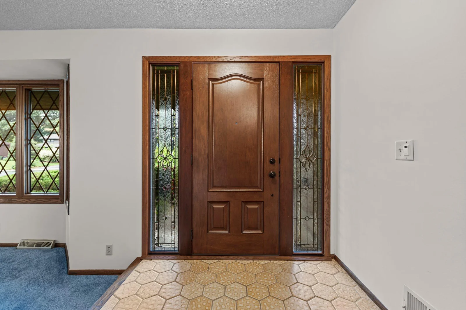 Attractive hardwood front door.