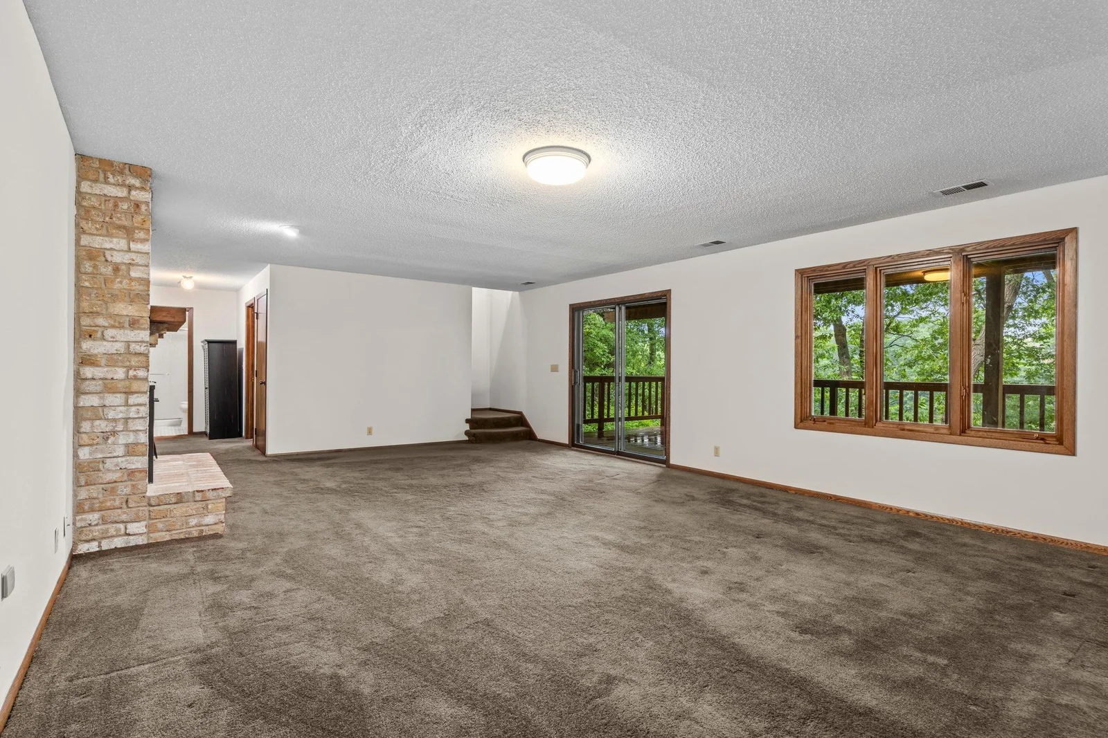 View of the recreation room looking out toward the deck and Karth Lake.