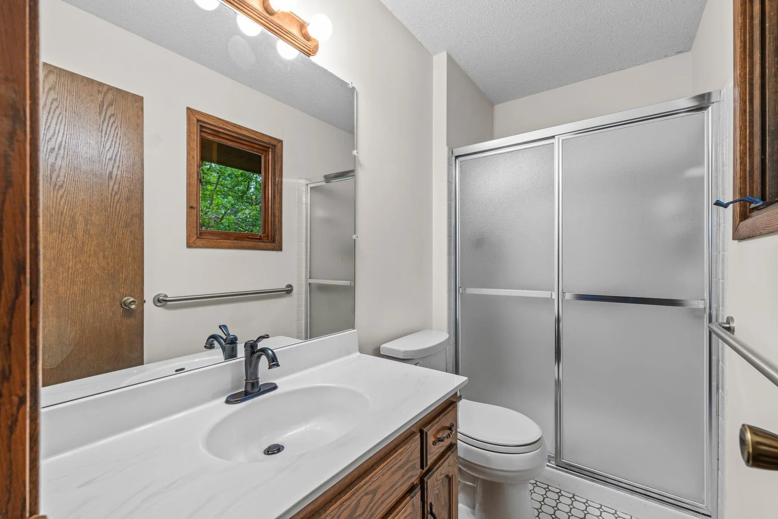 Primary 3/4 Bathroom with tile floors.