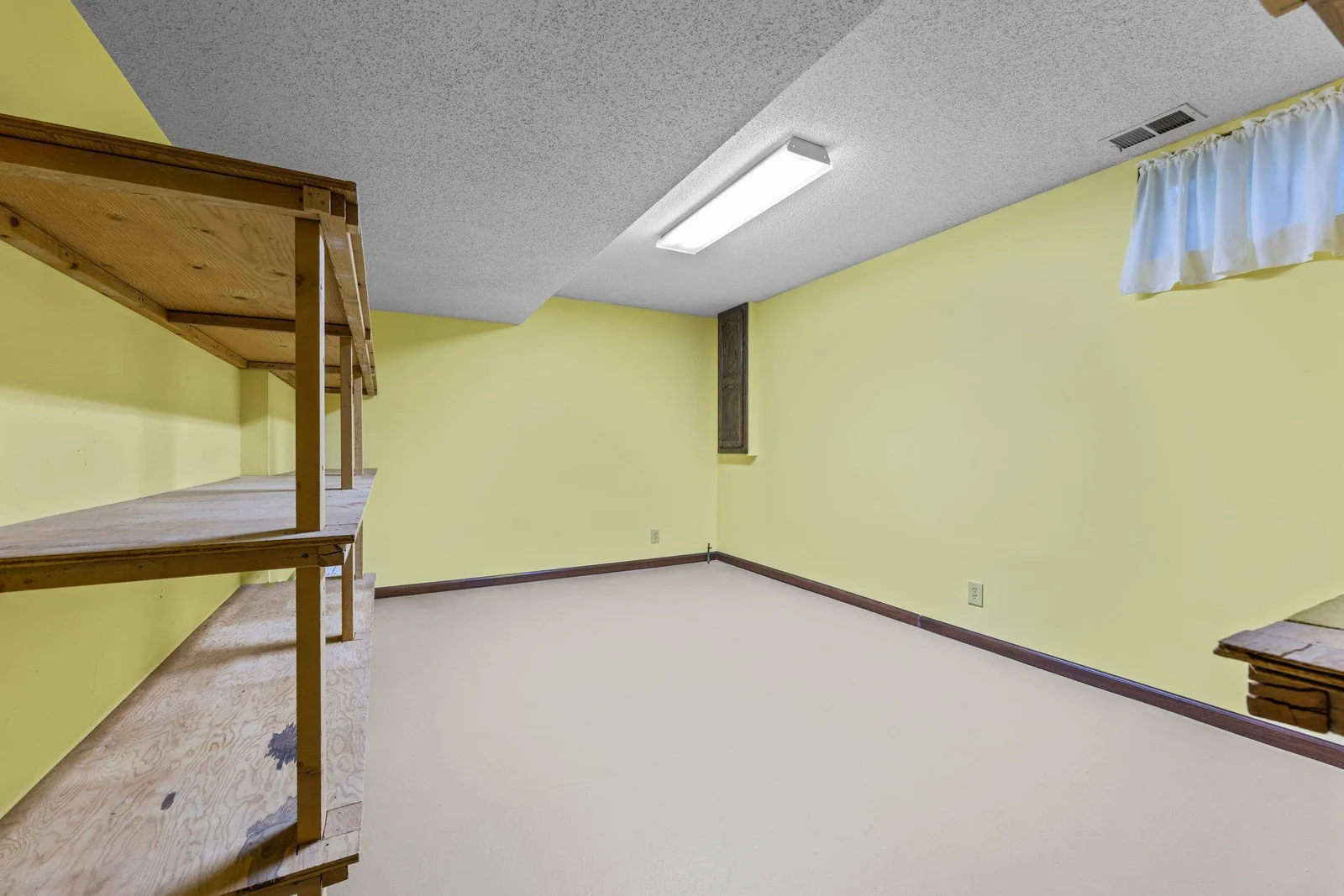 This storage room is super spacious and could possibly be made into a 4th bedroom with the addition of an egress window and closet.
