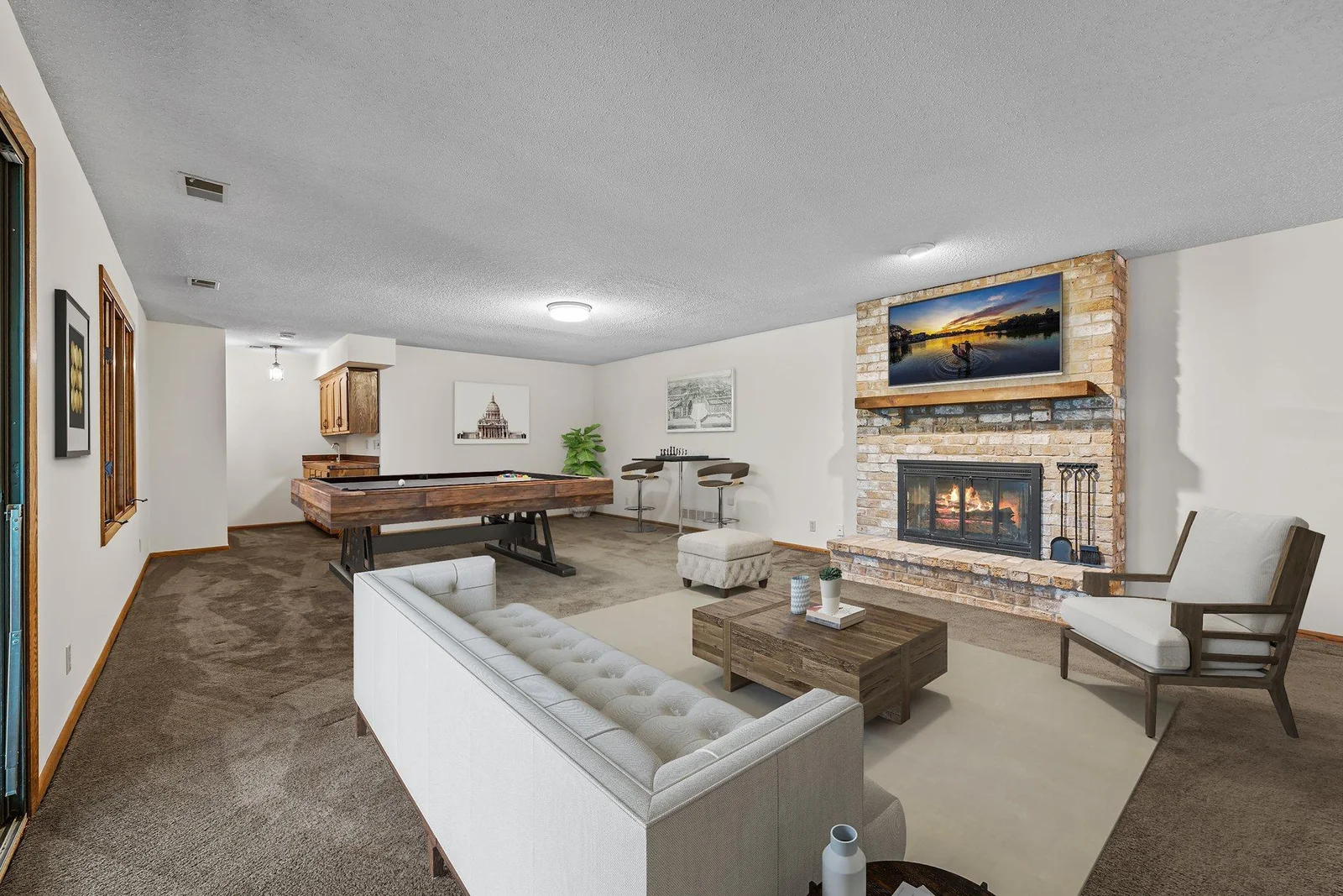 This lower level recreation room is the perfect place to host a gathering. Imagine having your friends over for a game night. There is plenty of room for your pool table or other gaming tables. This room has been virtually staged.