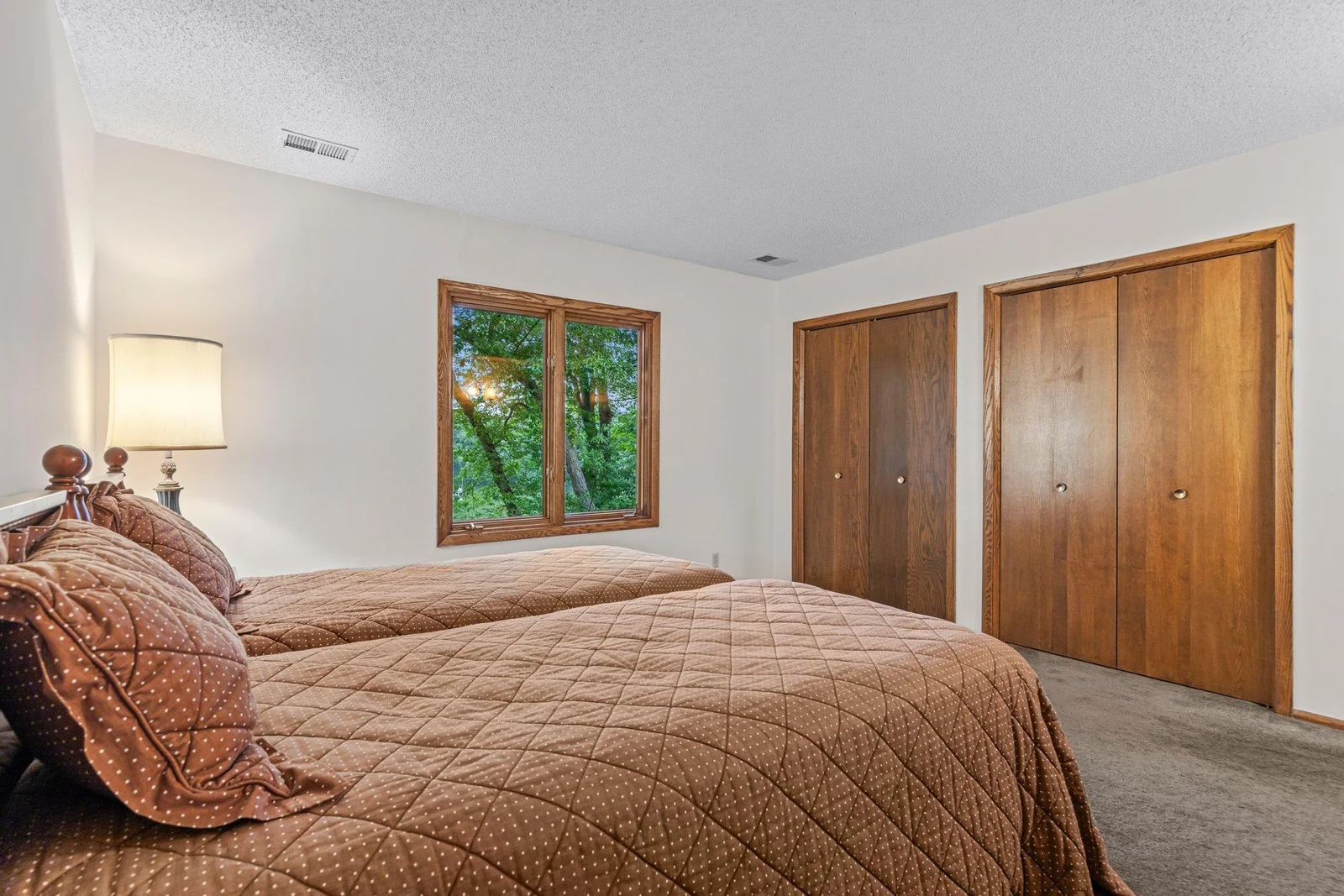 Alternate view of the lower level bedroom looking out toward Karth Lake.