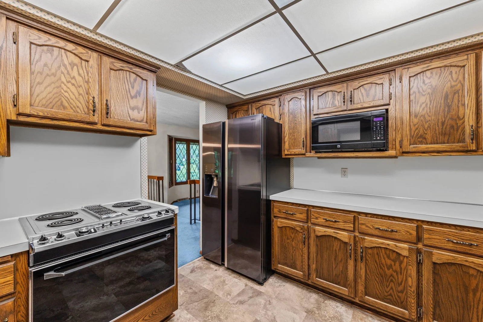 Secondary view showcasing the appliances and cabinetry.
