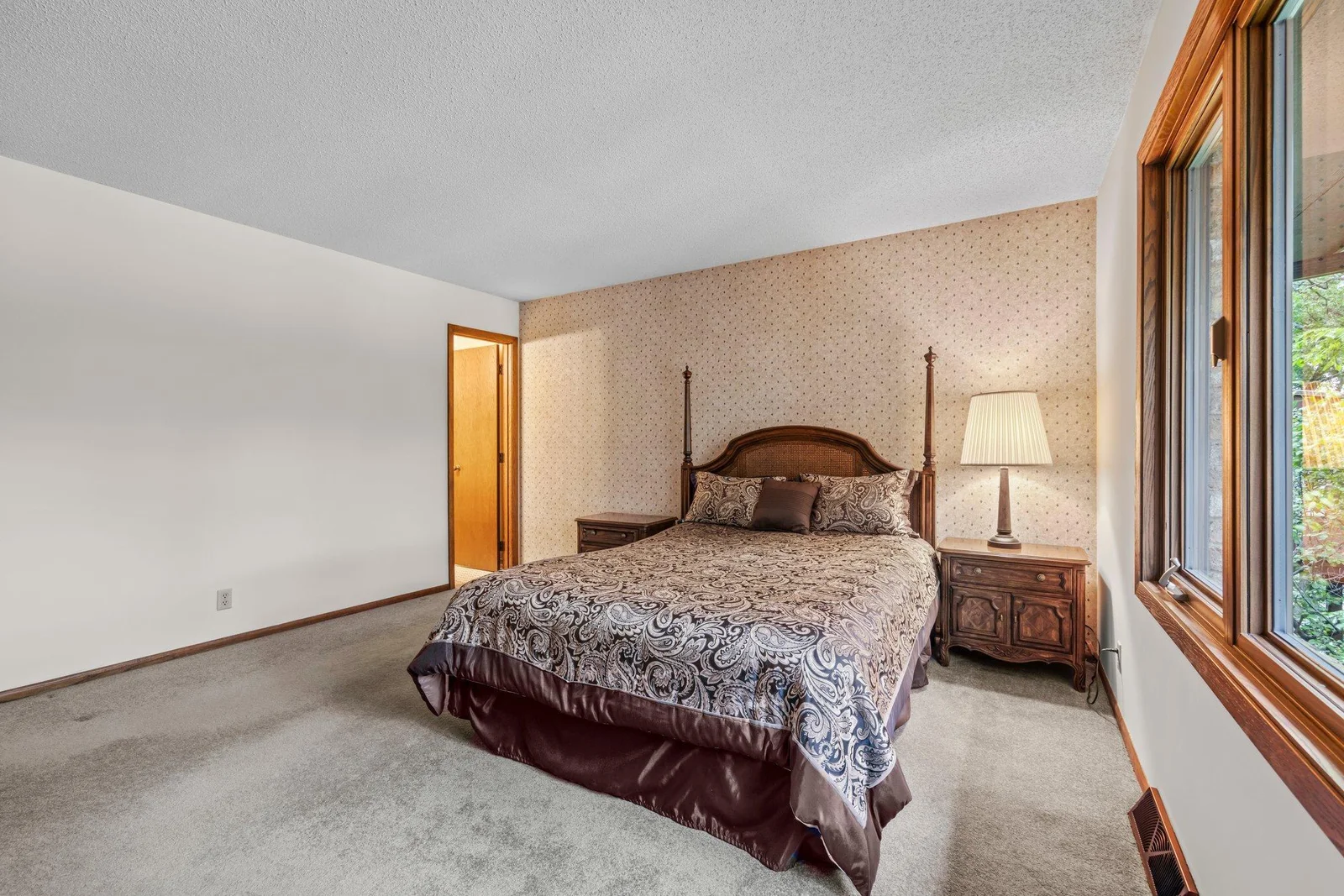 The spacious primary bedroom faces Karth Lake.