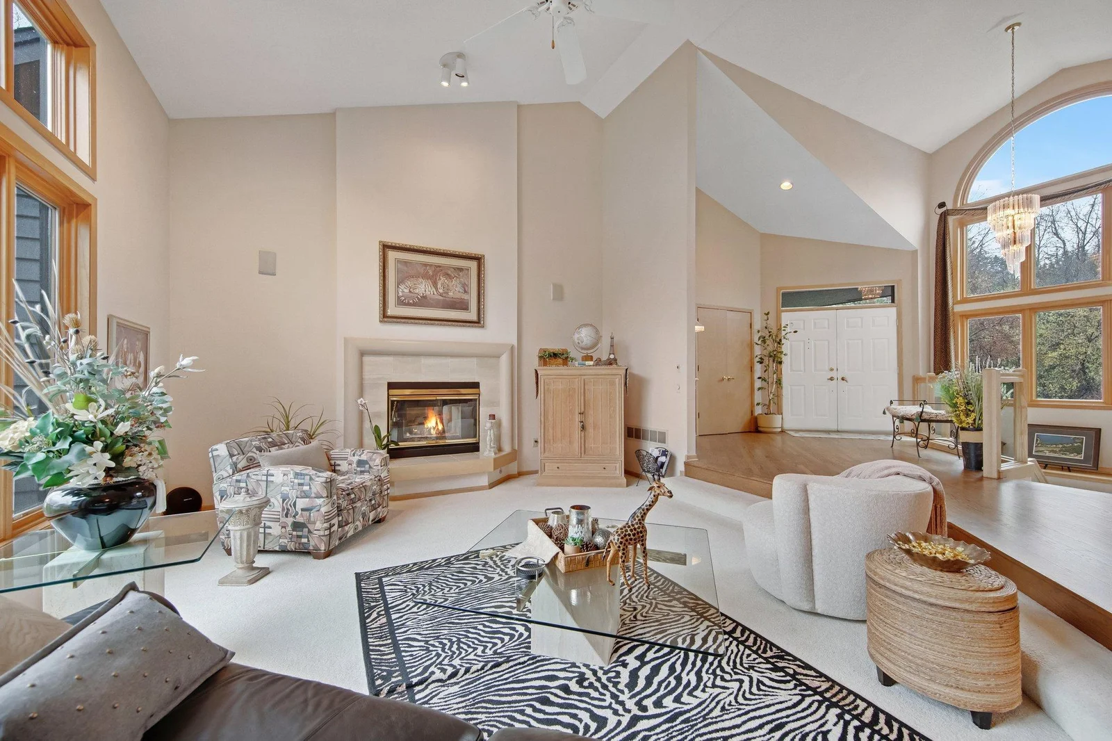 Gas Fireplace - with large windows throughout the home - bringing in natural light throughout the year