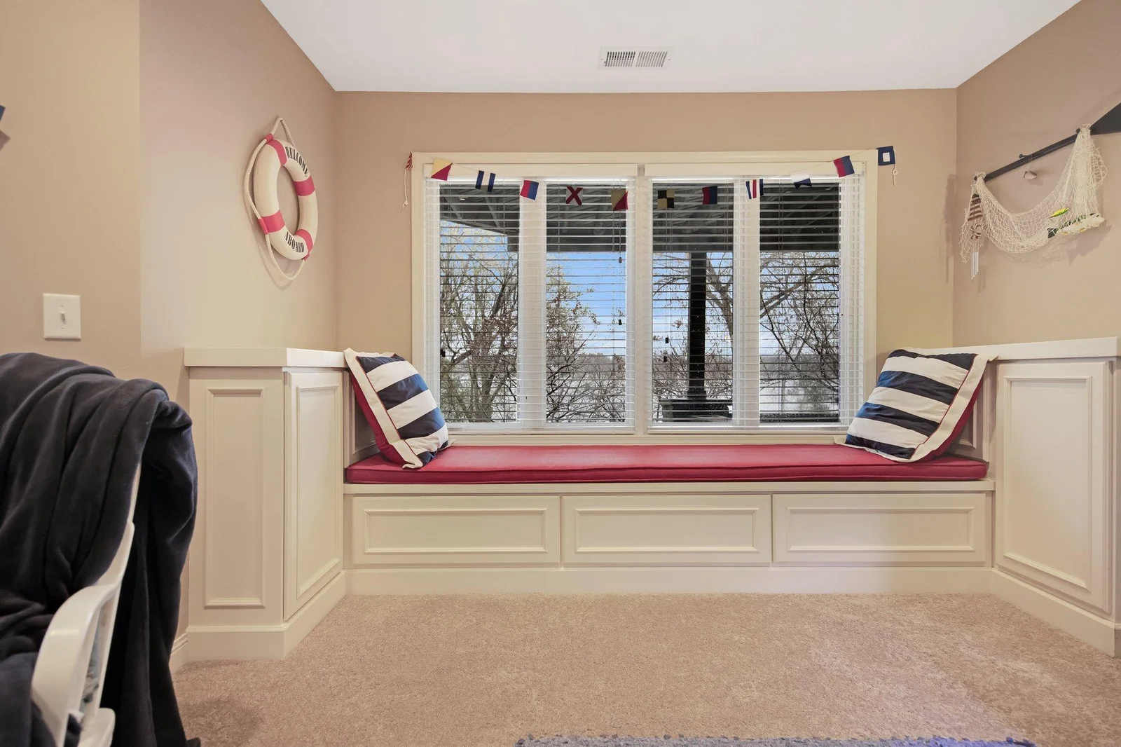 window seat has storage on the sides and below - custom woodwork throughout