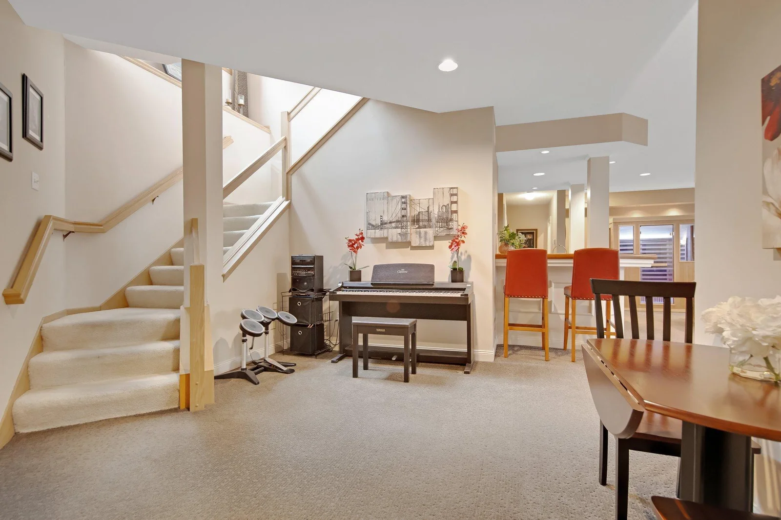 Lower Level has raised ceilings, a wet bar and a large TV/Home Theatre - the screen drops down from the ceiling - this will stay with the home.