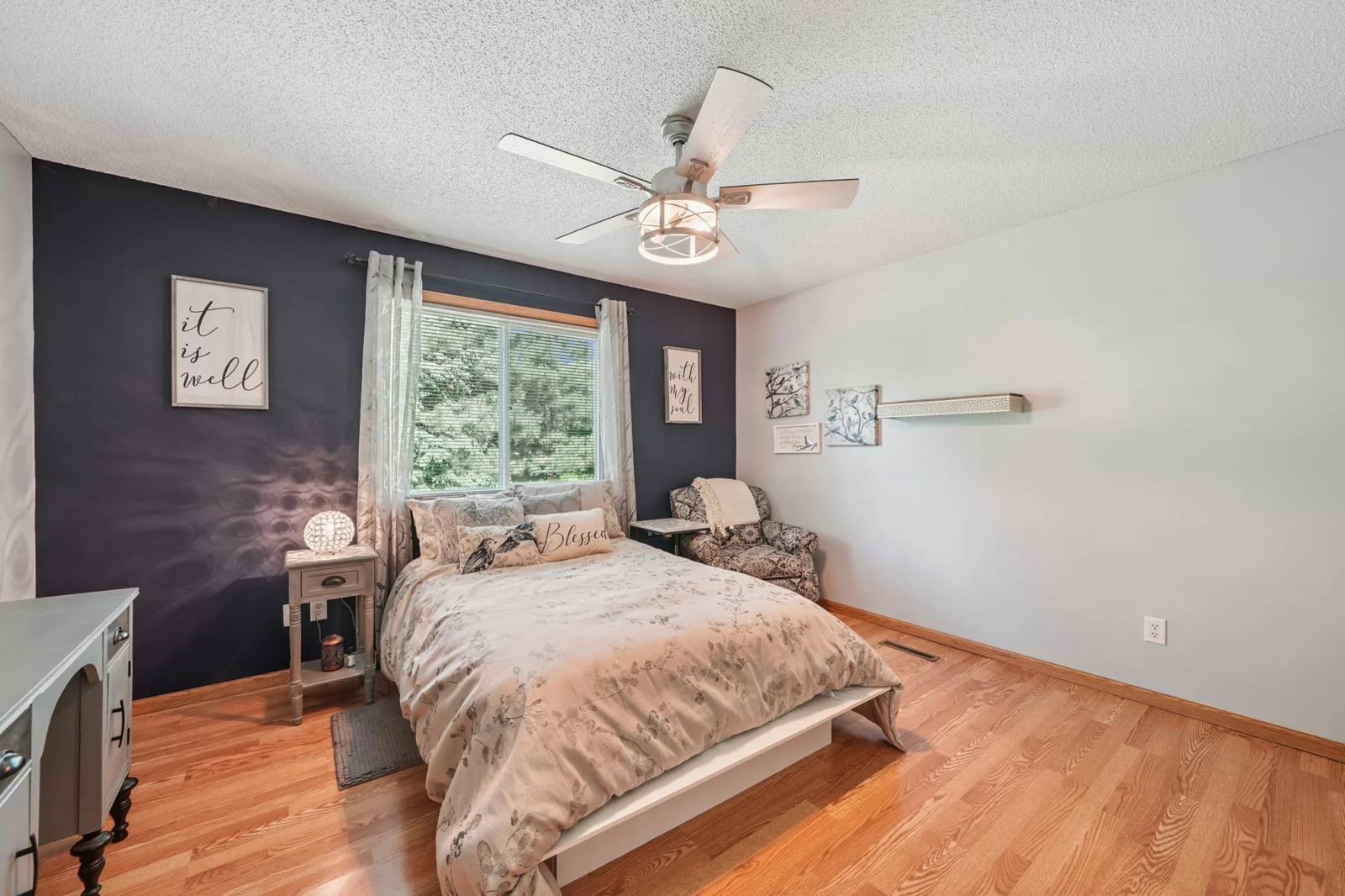 Primary bedroom with walk-in closet and private primary 3/4 bath.
