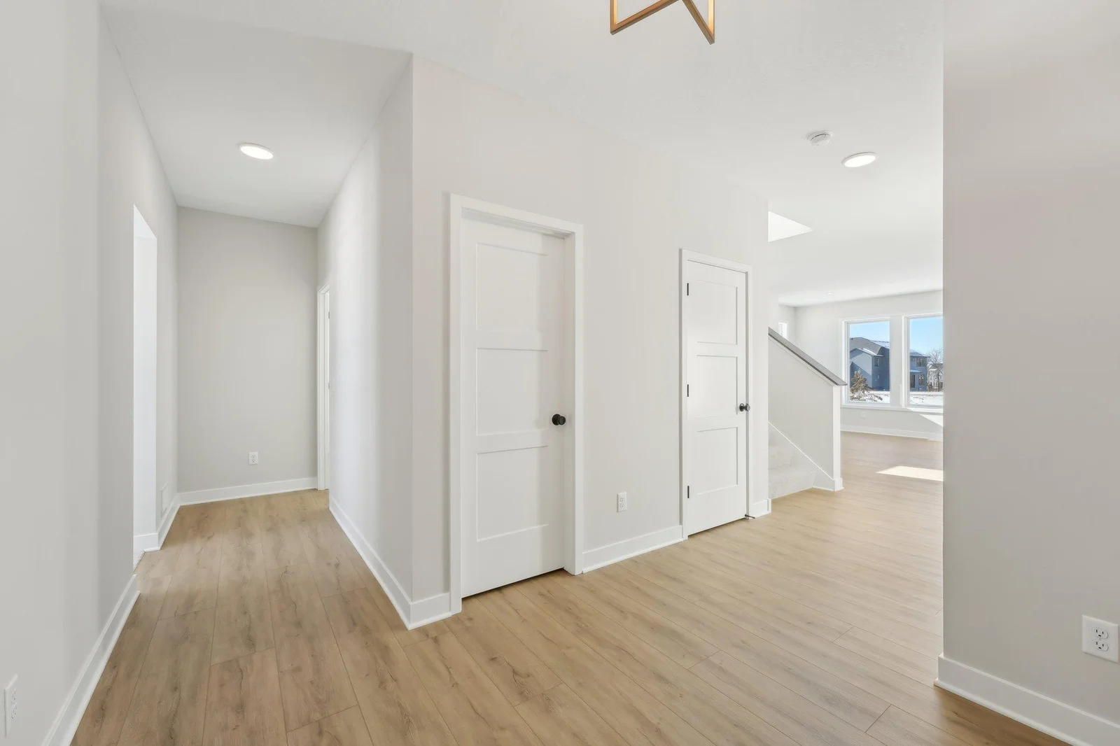 Spacious front foyer that leads into the powder bathroom and secondary flex room