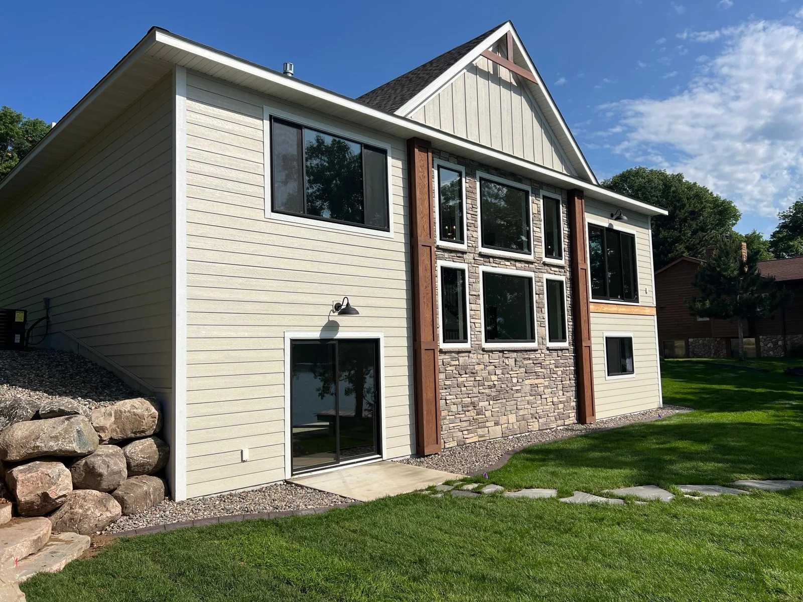 Love the stone and the black windows!