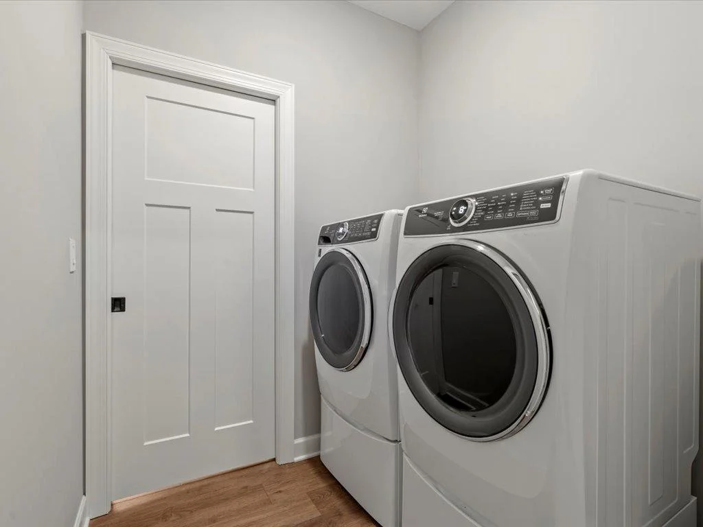 Main floor laundry right off master closet & hallway.