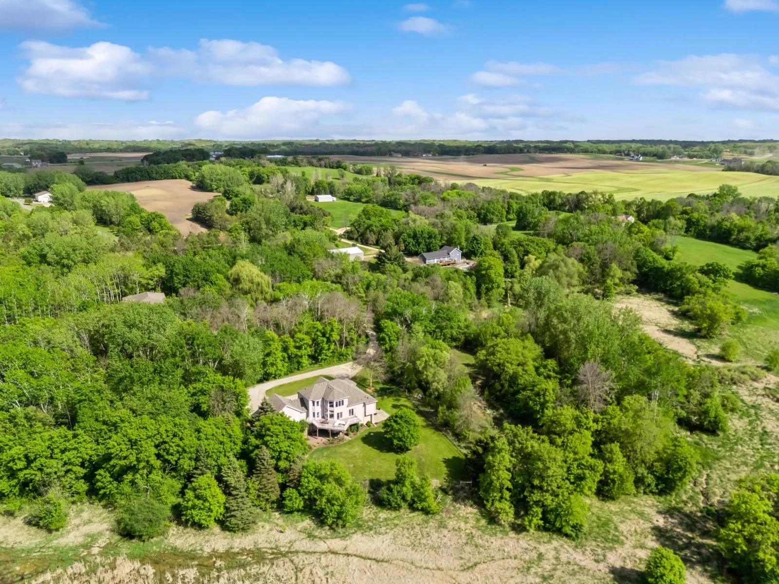 Peaceful setting on 6.5 acres with sweeping views of wildlife filled wetlands and wooded privacy.