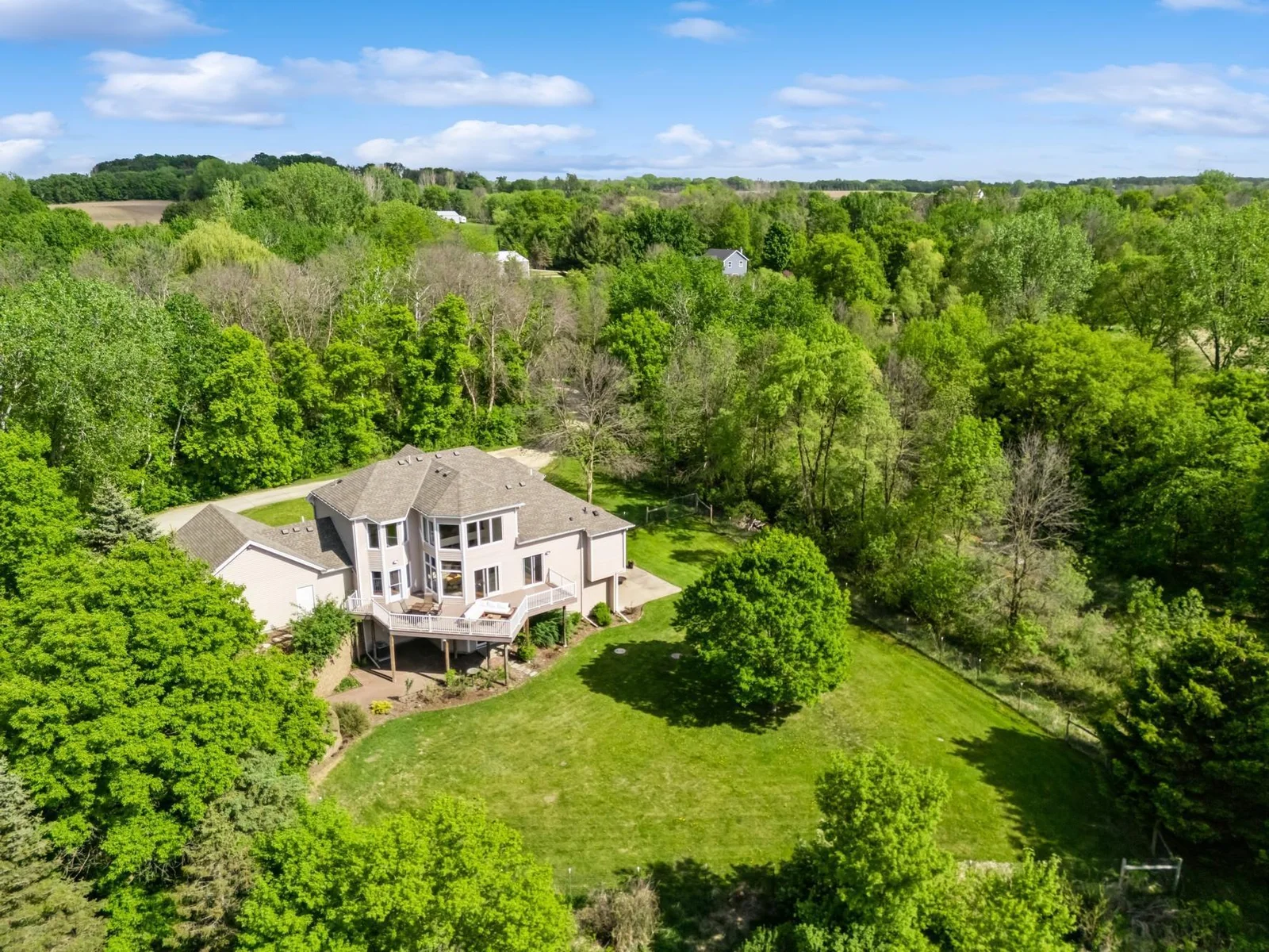 Beautifully landscaped gardens, retaining walls, recently fenced acre, and room for outbuildings. Perfect backyard for pets, gardening, or play.