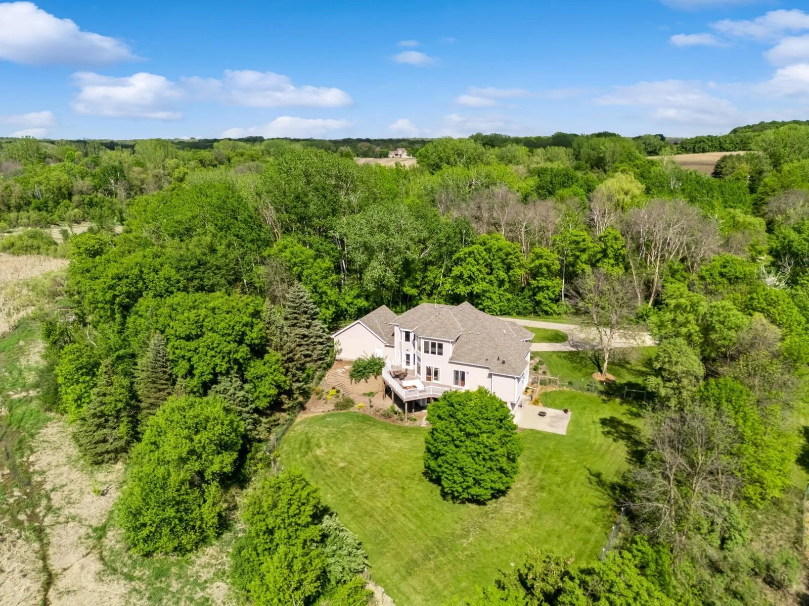 Peaceful setting on 6.5 acres with sweeping views of wildlife filled wetlands and wooded privacy.