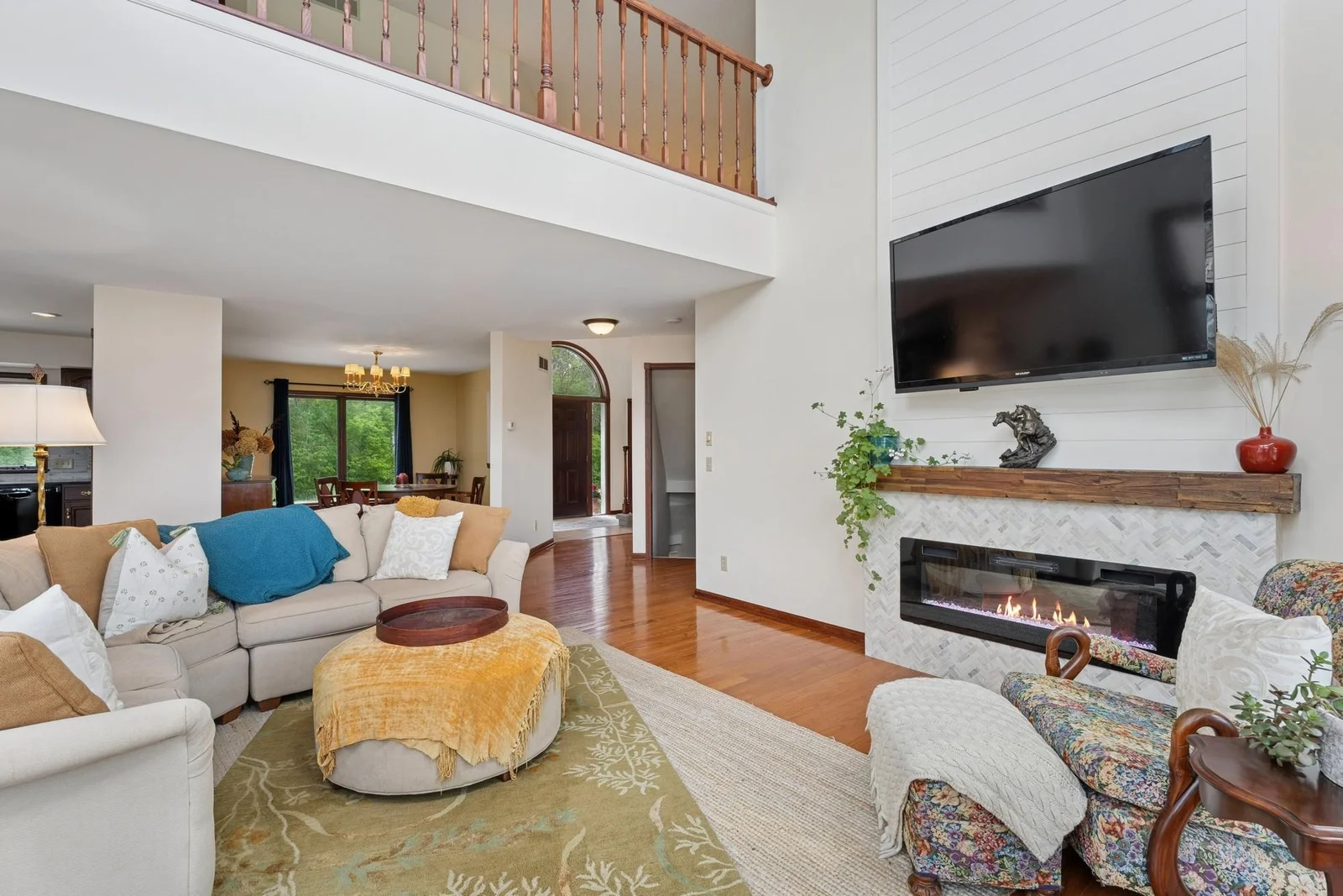 Loft area overlooks light and bright living room with beautiful new fireplace