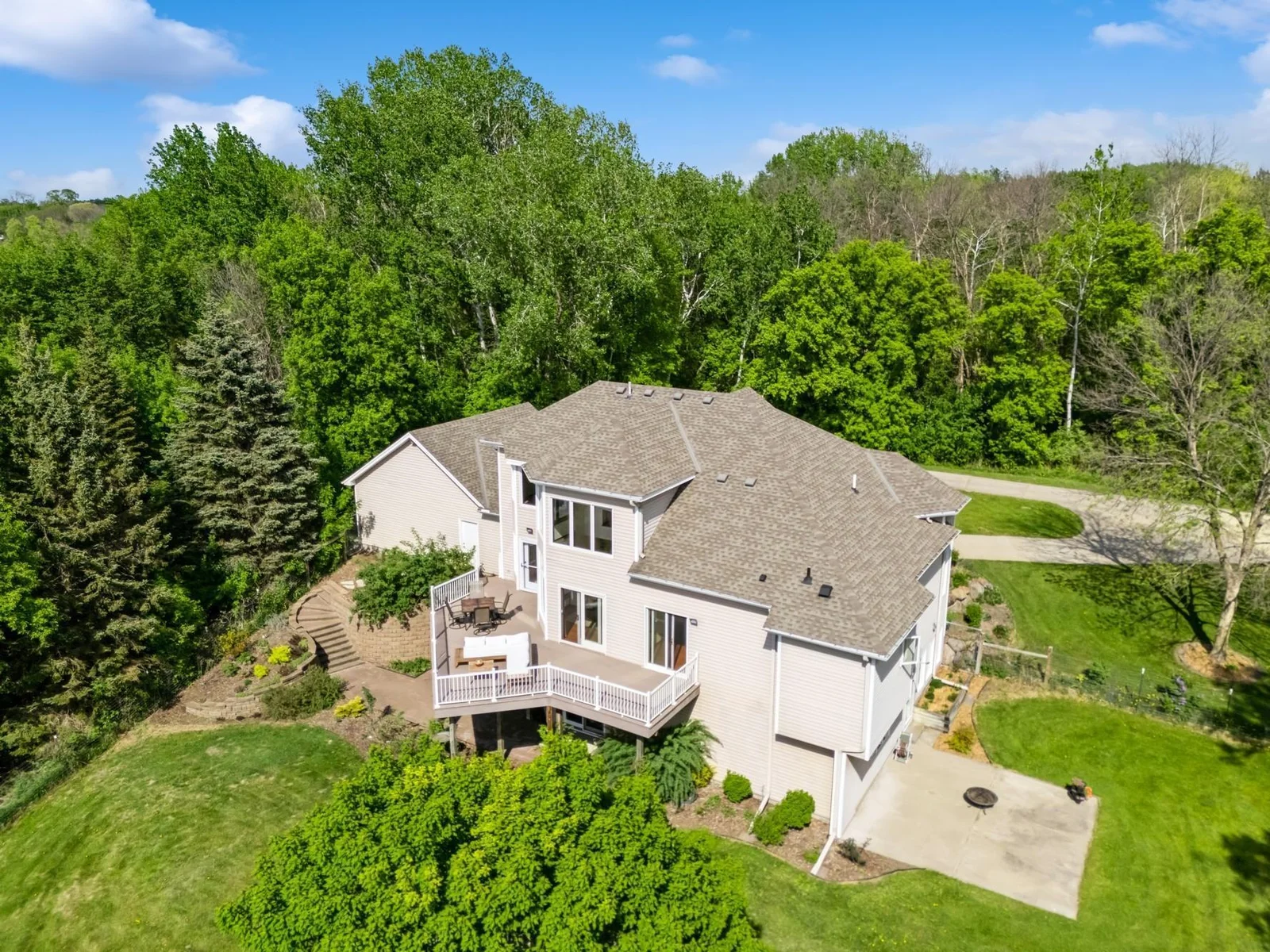 Beautifully landscaped gardens, retaining walls, recently fenced acre, and room for outbuildings. Perfect backyard for pets, gardening, or play.