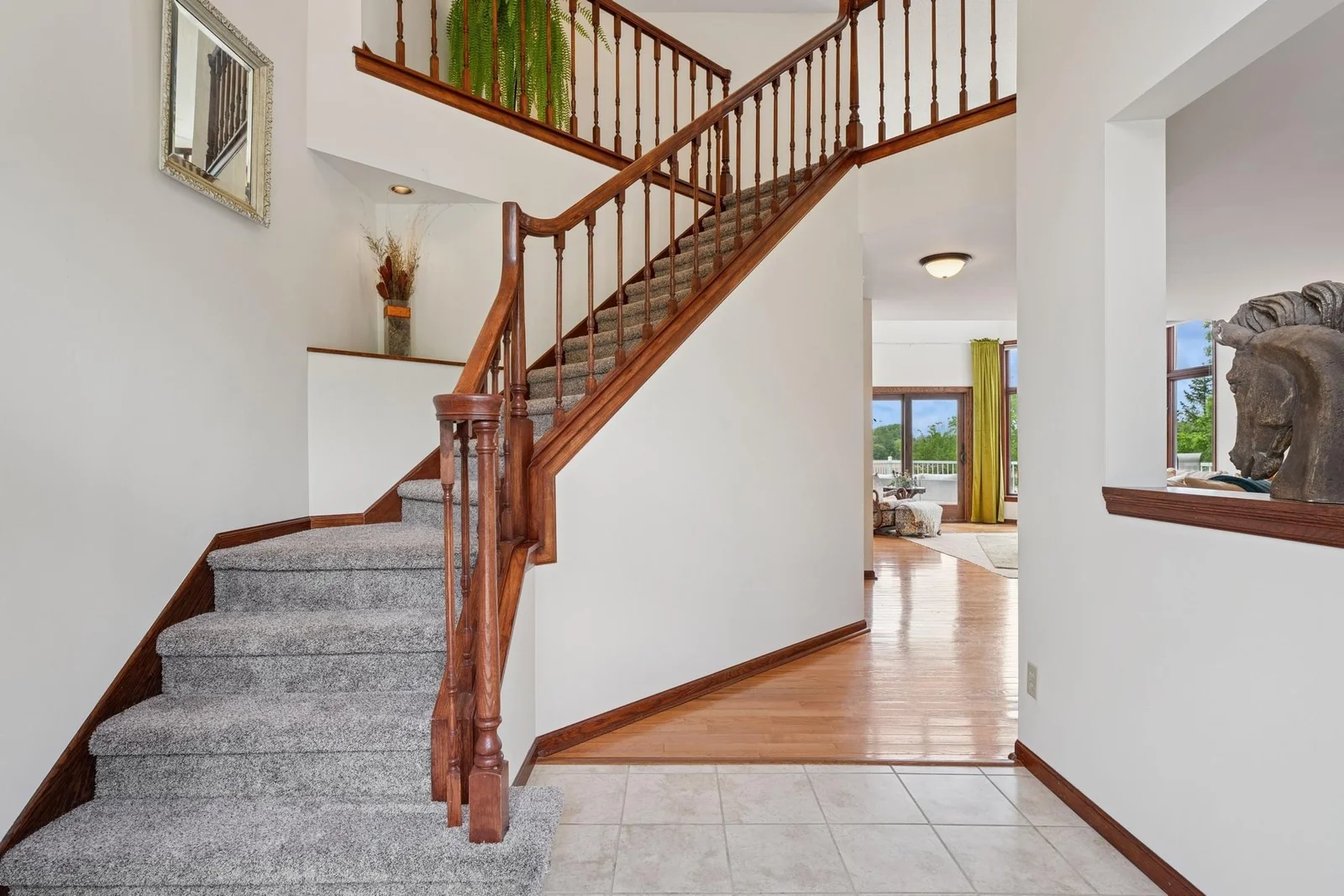 Dramatic front entry with cut out window to formal dining room