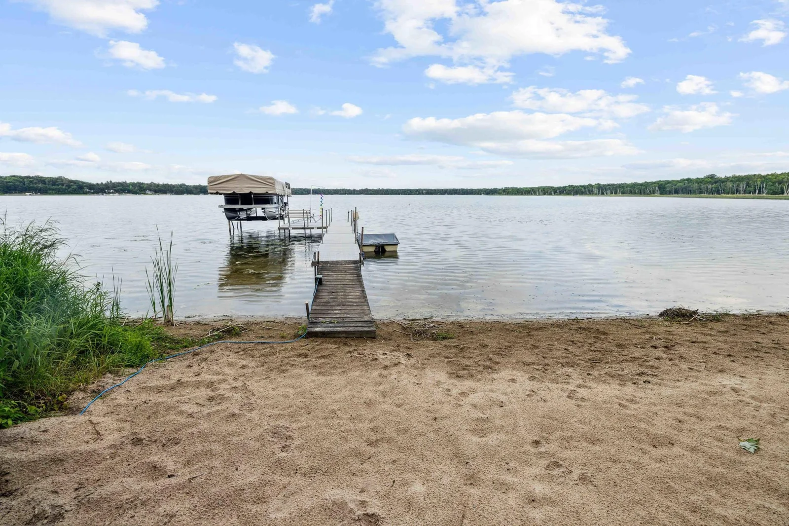 level beach area with aluminum dock