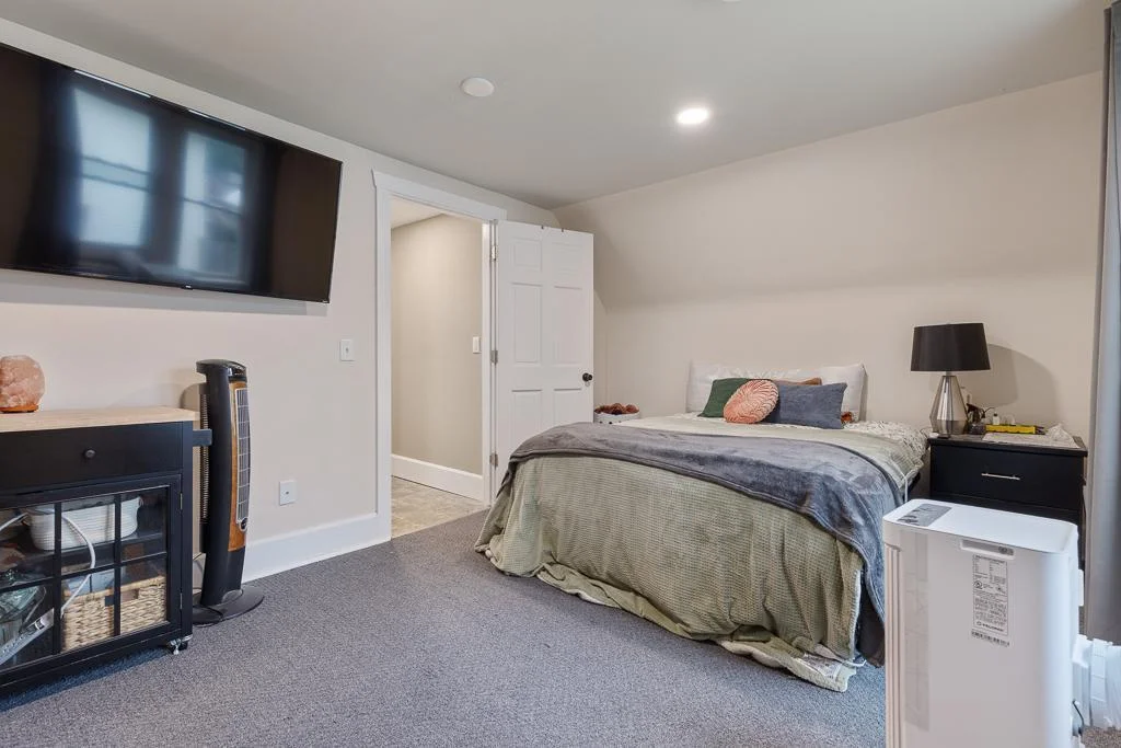 This bright and comfortable bedroom also features a walk-in closet—perfect for added storage and organization.