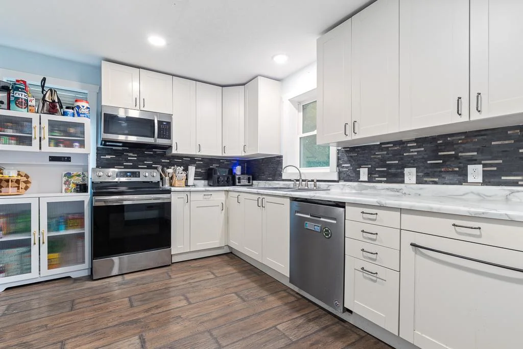 The kitchen comes equipped with sleek stainless steel appliances, adding both style and functionality to your cooking space.