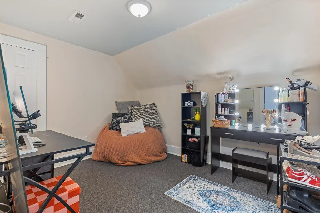 This cozy third upstairs bedroom offers great natural light and flexibility—perfect for a bedroom, hobby room, or extra office space.