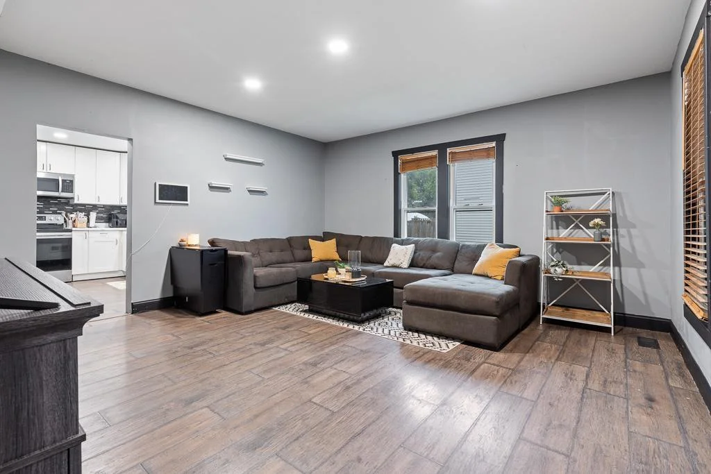 A warm and spacious area filled with natural light and updated recessed lighting, perfect for relaxing or entertaining family and friends.