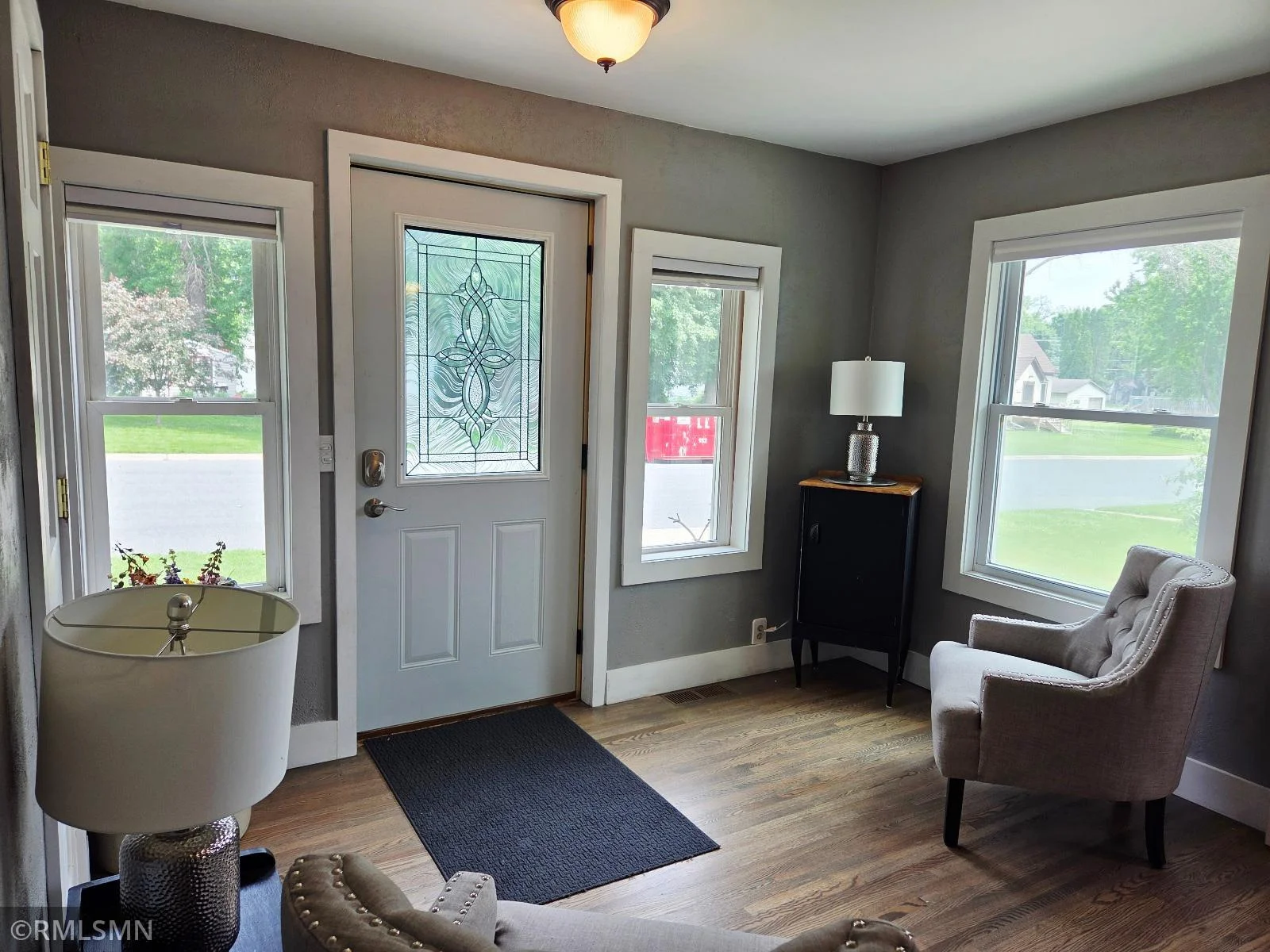 A cheerful welcome with natural light and cozy vibes.