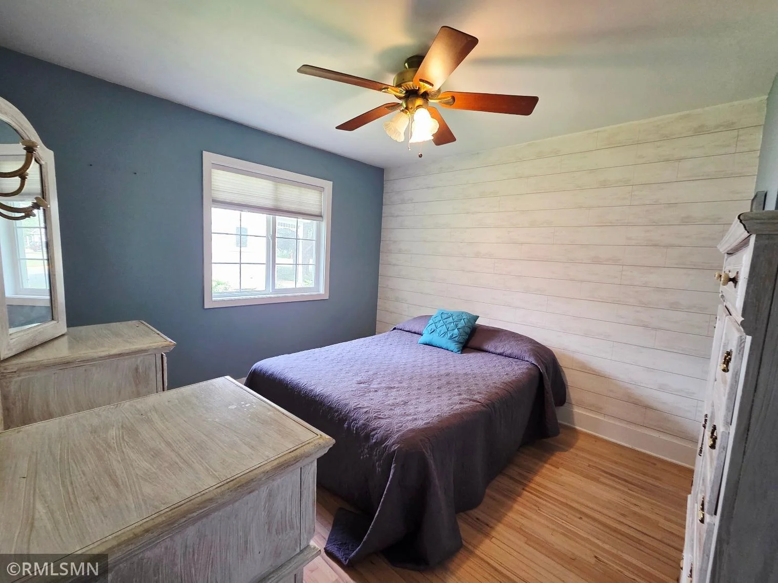 Main-level primary bedroom with plenty of natural light.