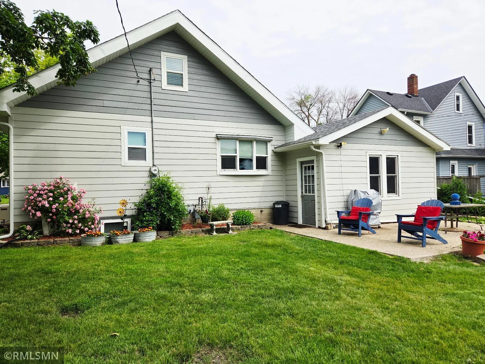 Step out from the garage to a sunny cement patio.