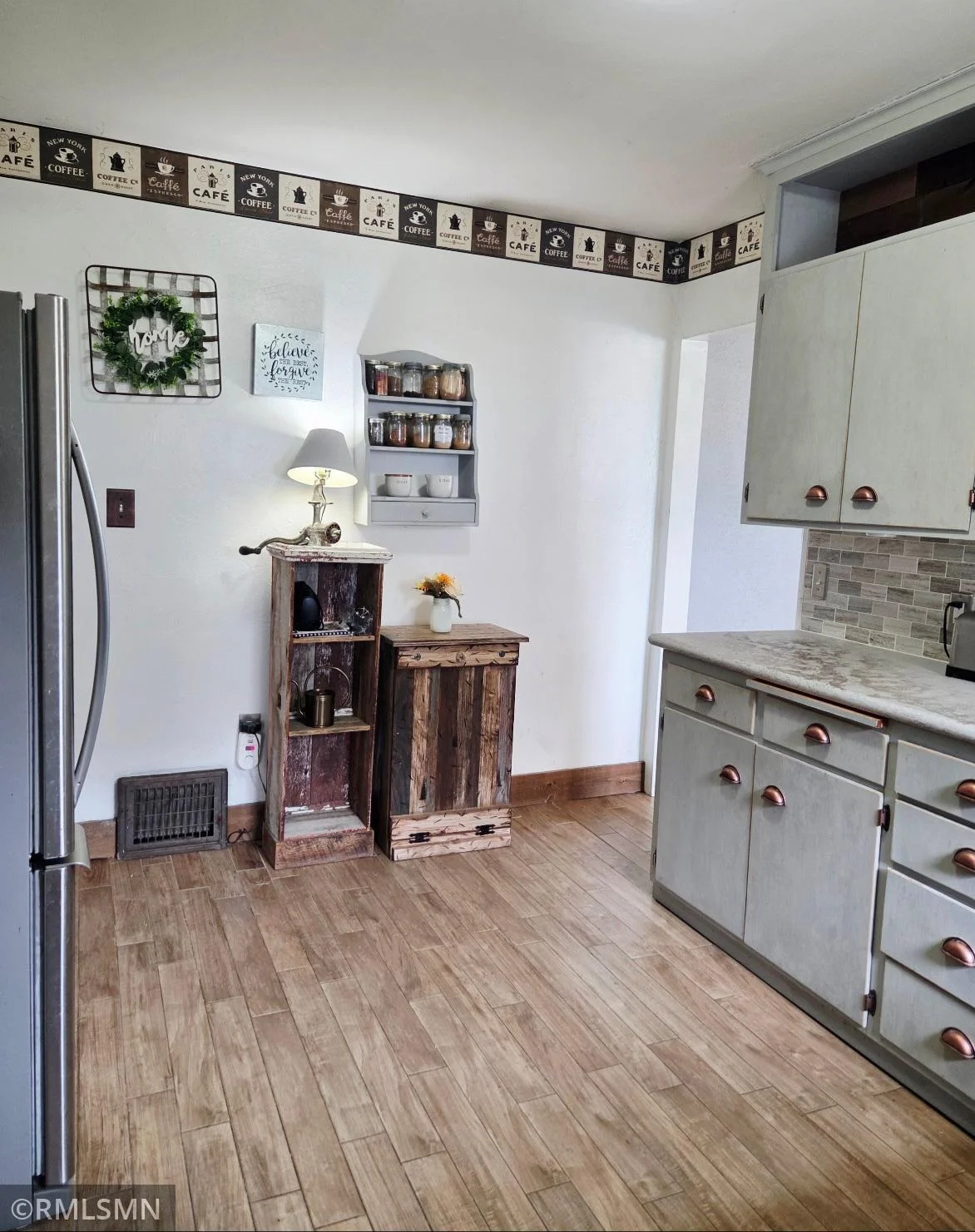 Warm hardwood floors add character to this cozy kitchen.