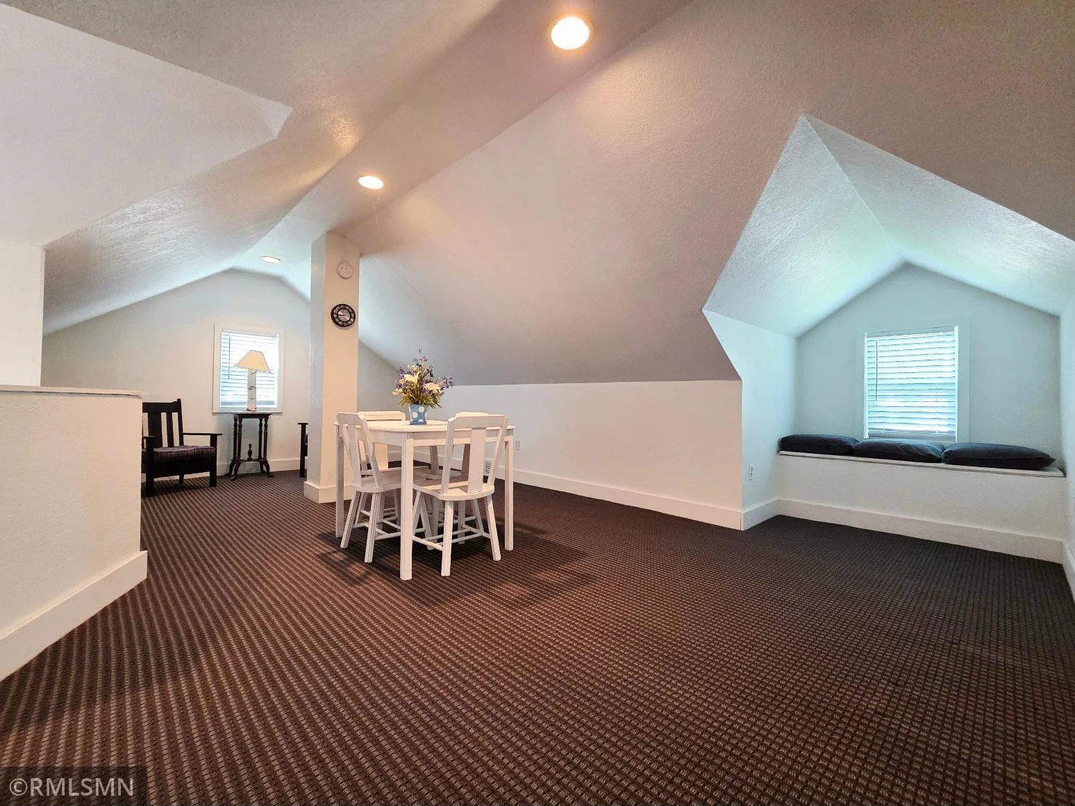 Spacious upstairs loft with window bench = ultimate flex space.