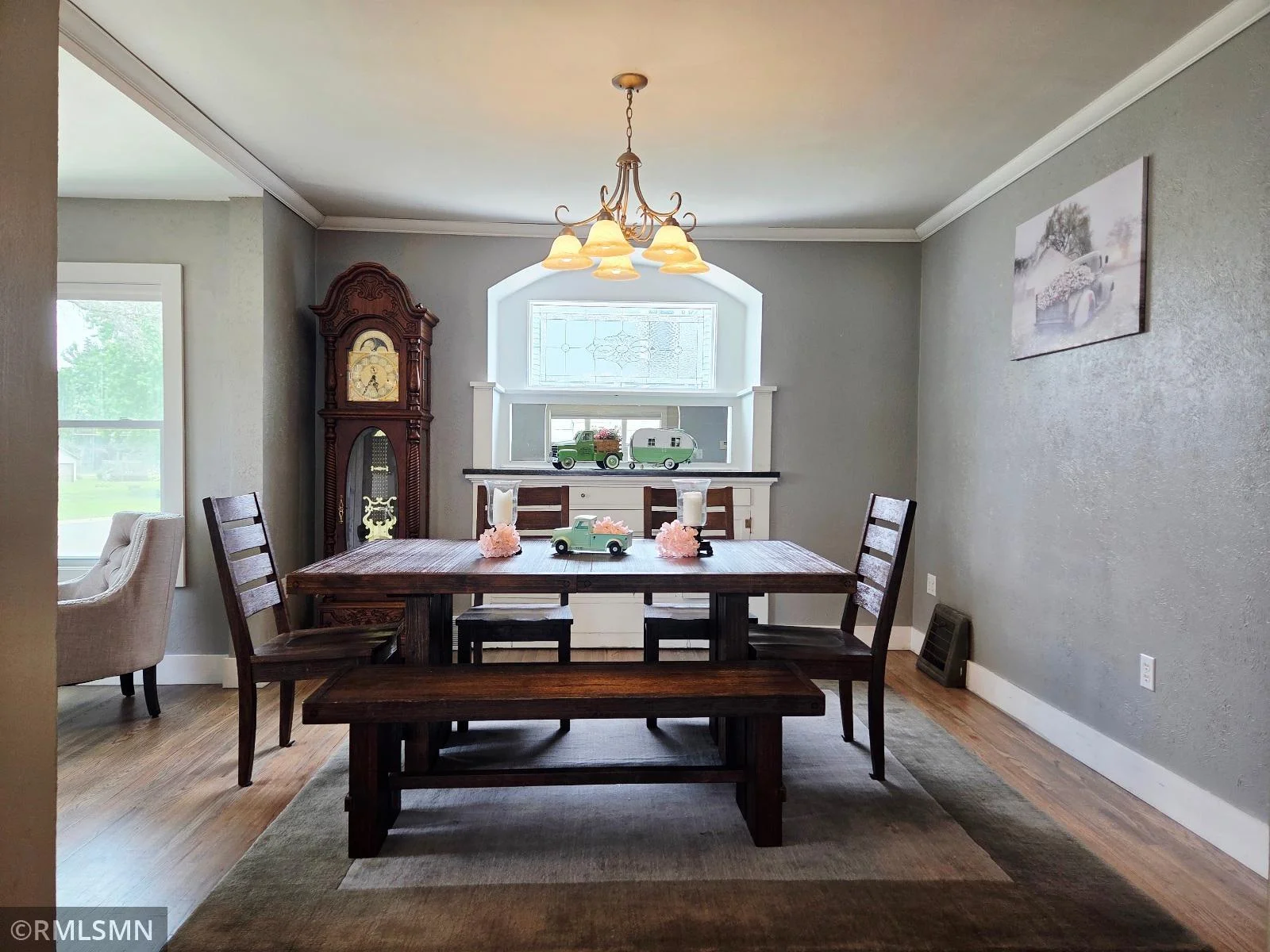 Step into a dining room with original built-ins and custom glass.