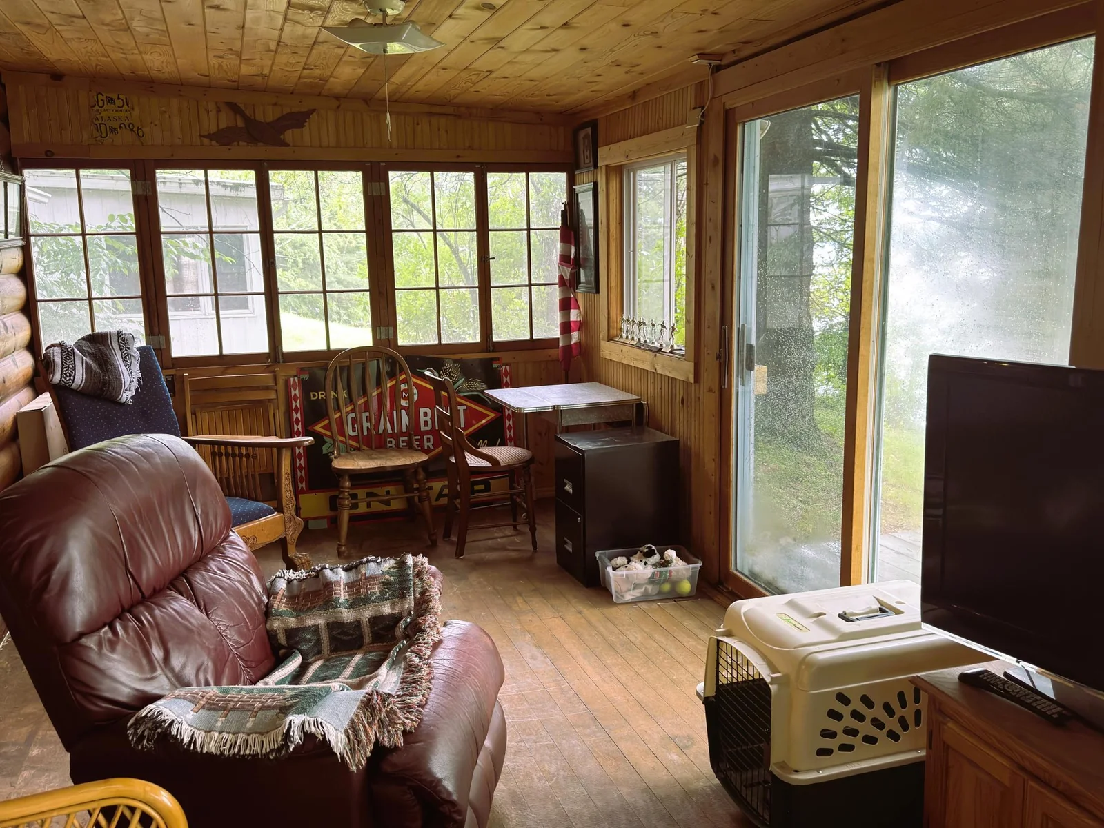 Red cabin lakeside porch with slider