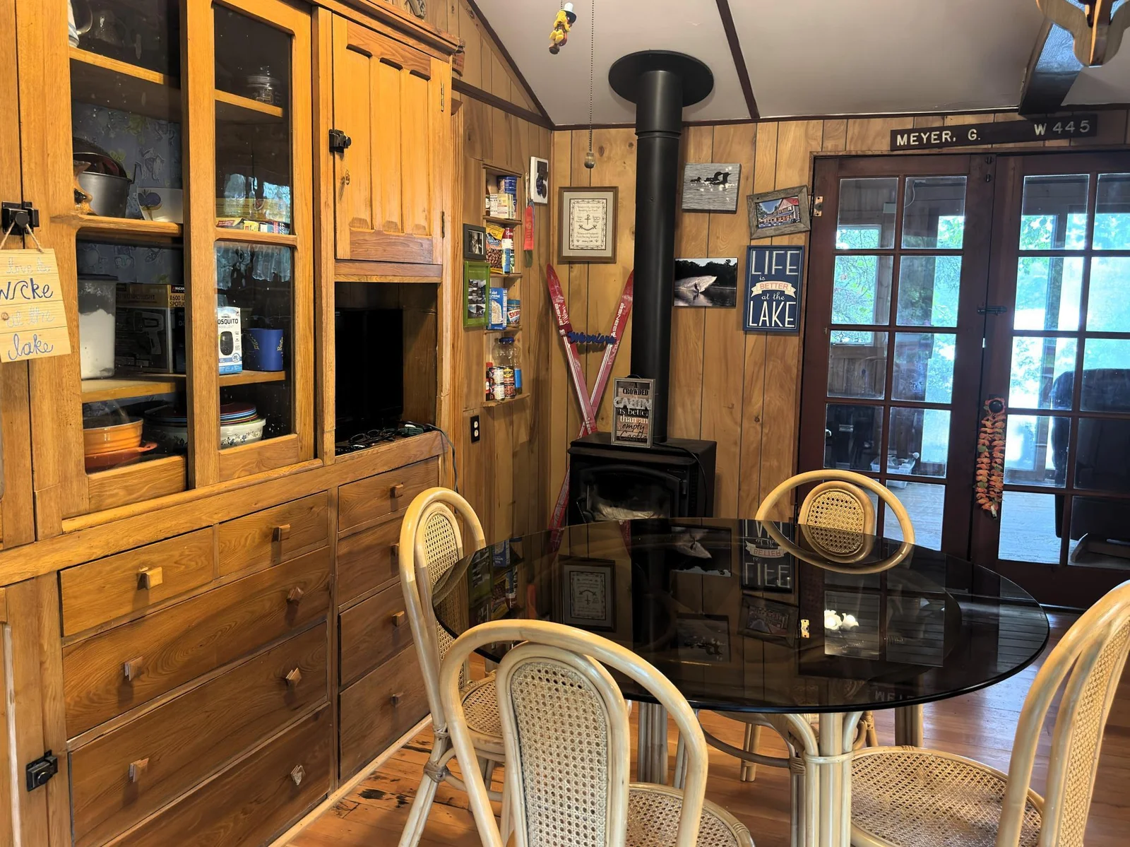 Red cabin dining room with lake view