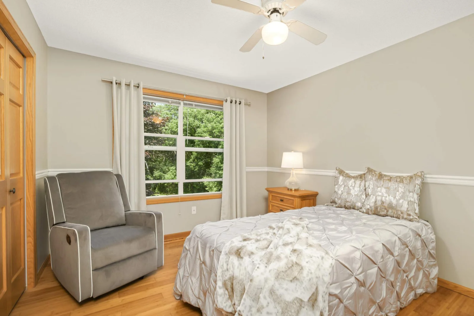 The second upper-level bedroom is nicely sized and features durable, carefree luxury vinyl flooring.