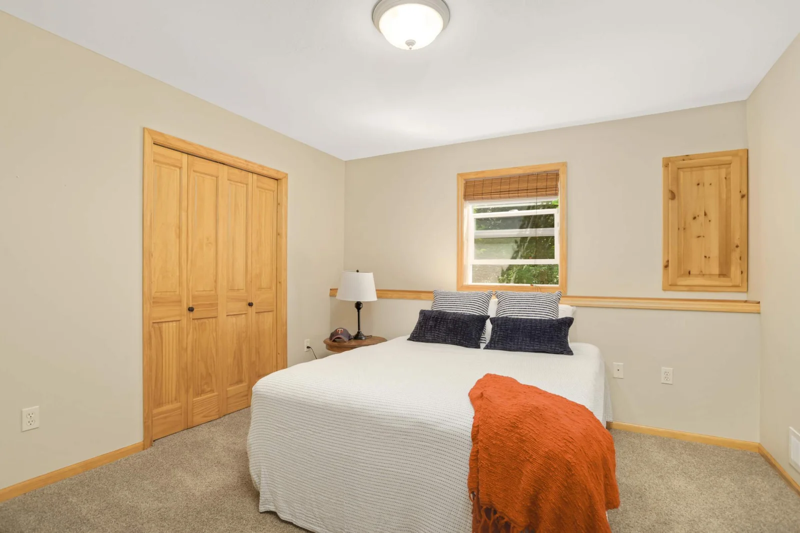 The lower-level fifth bedroom is ideal for larger families or guests, conveniently located just steps from a ¾ bathroom.