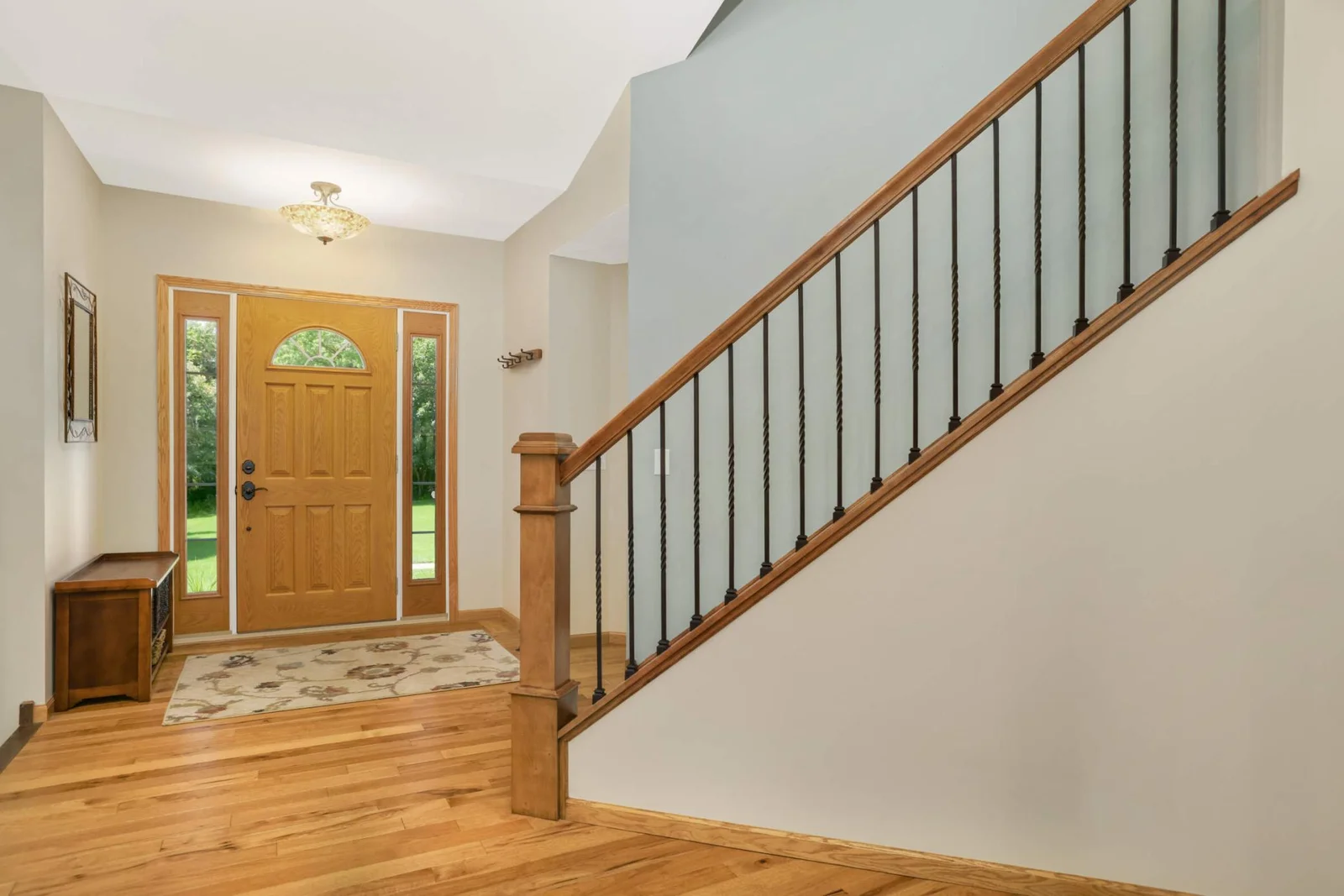 The wide open front entry offers a warm welcome with plenty of space for guests to step inside comfortably—no waiting at the door.