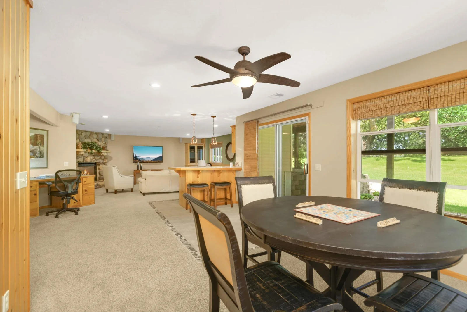 Let the family spread out in this spacious, sun-filled family room, where natural light pours in through large windows and the walk-out access enhances indoor-outdoor living.