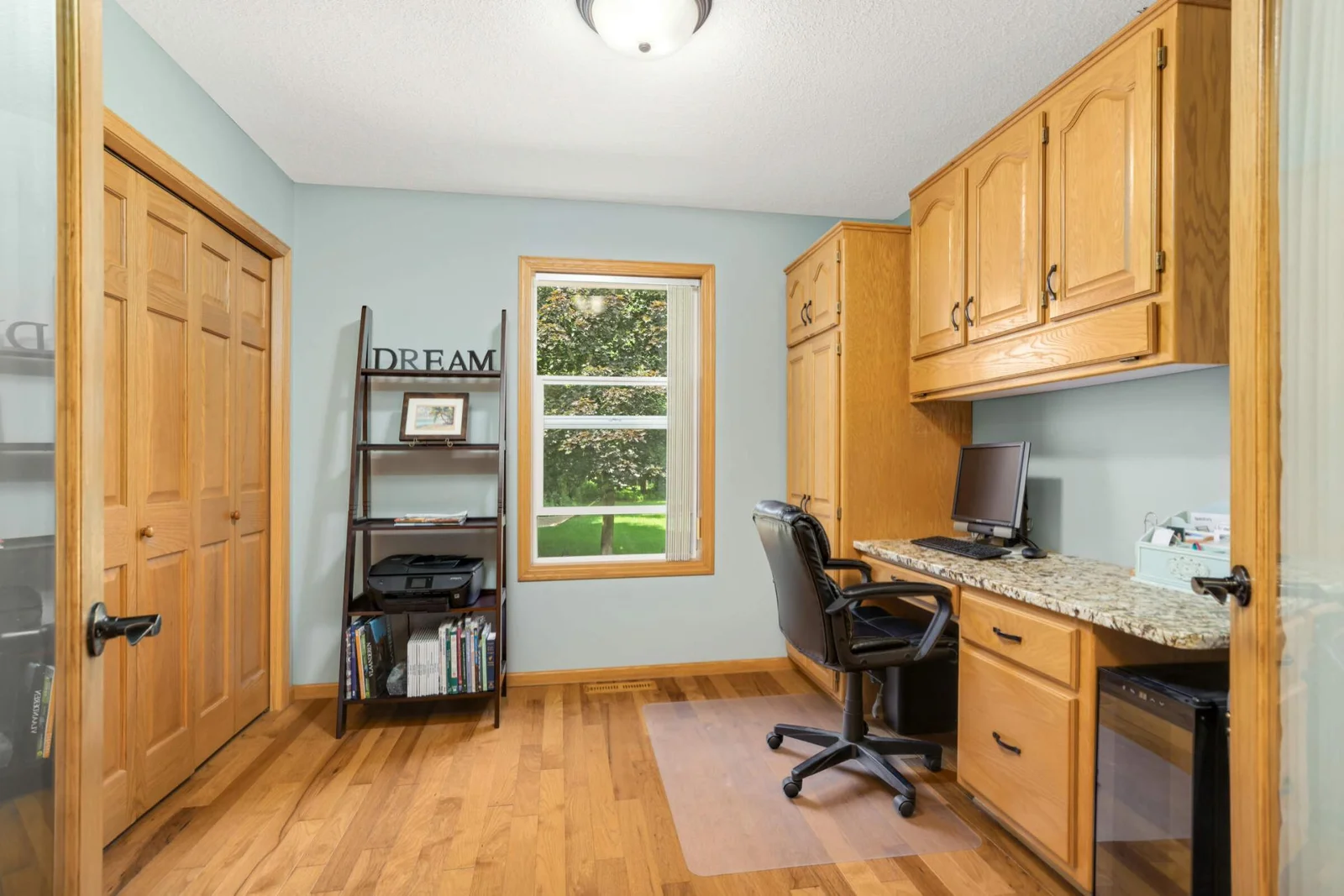 The main-level bedroom, currently used as an office, offers flexible space to fit your lifestyle needs.
