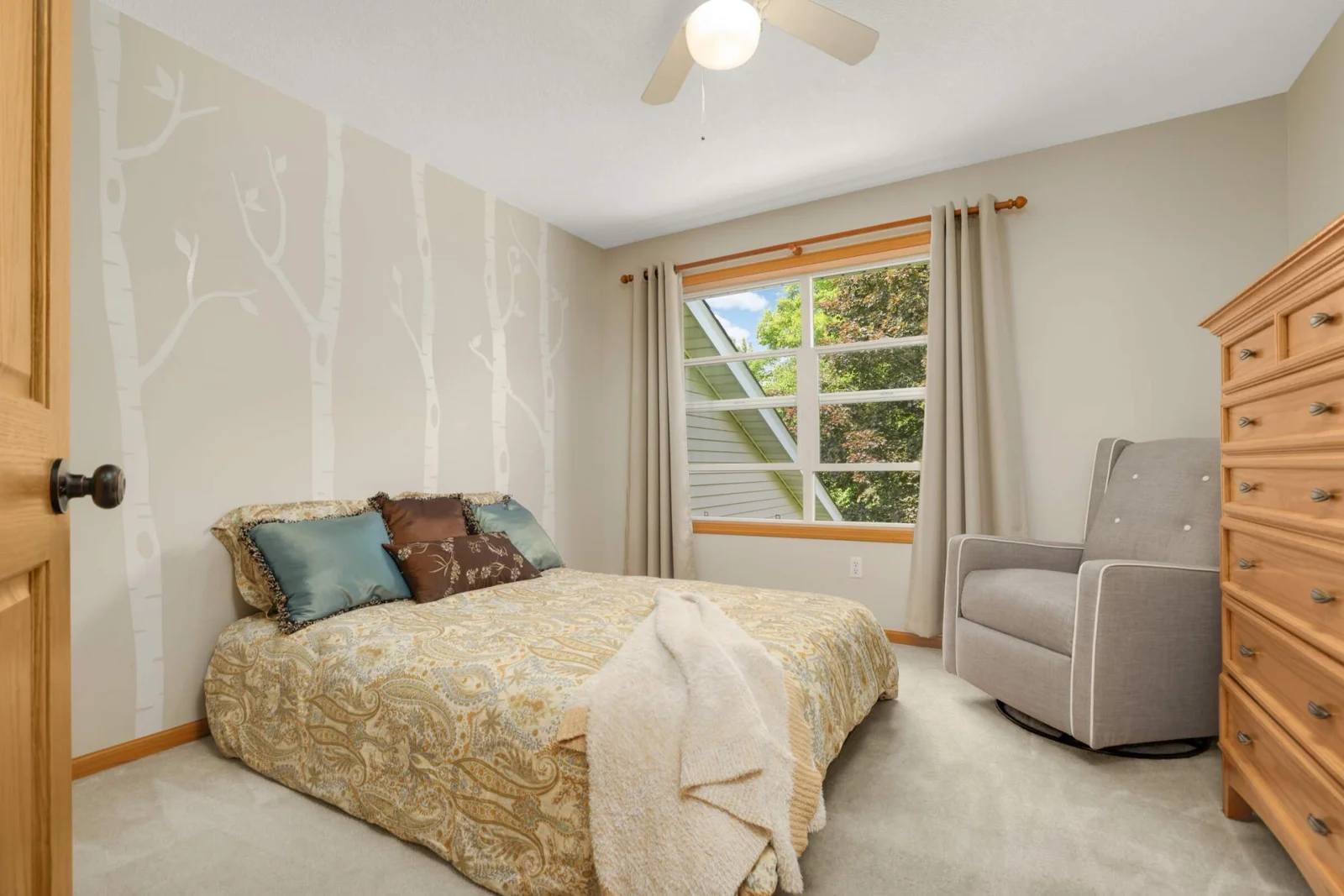 The third upper-level bedroom —imagine being able to sleep with the windows open and enjoying the tranquil surroundings.