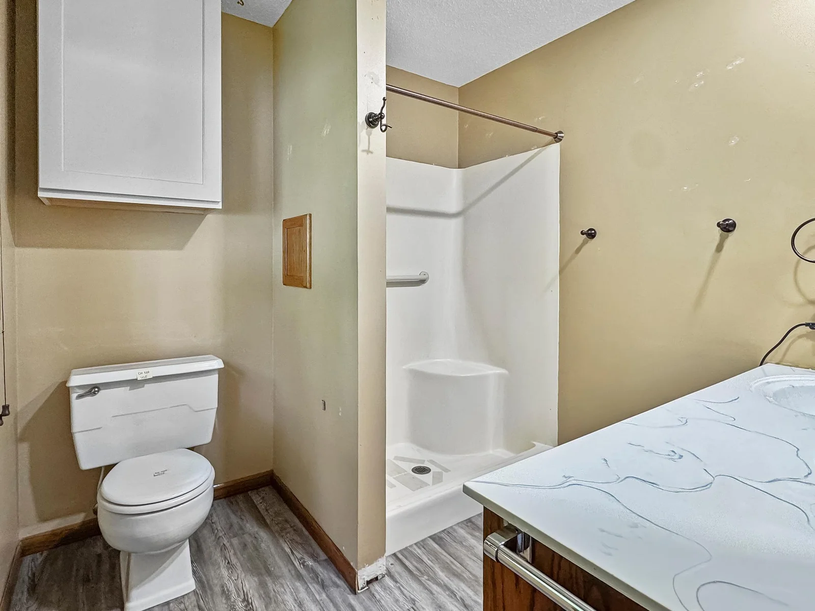 En suite bathroom, shower, sink, & toilet