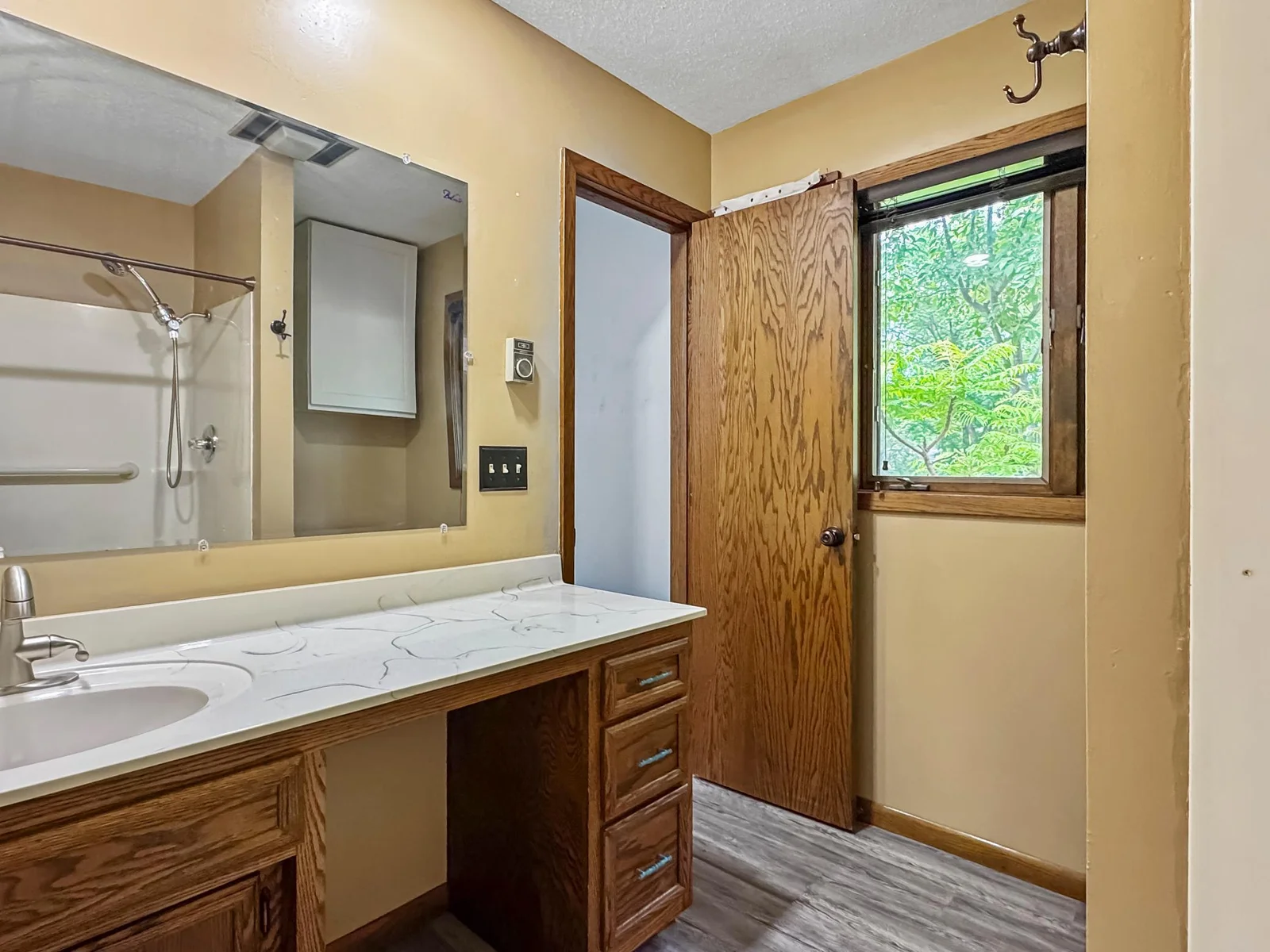 En suite bathroom, shower, sink, & toilet