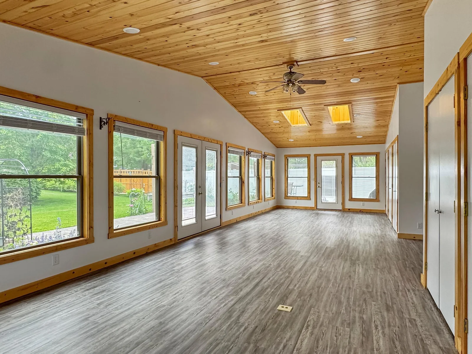 Beautiful Sunroom boasting lots of natural light with so much storage!