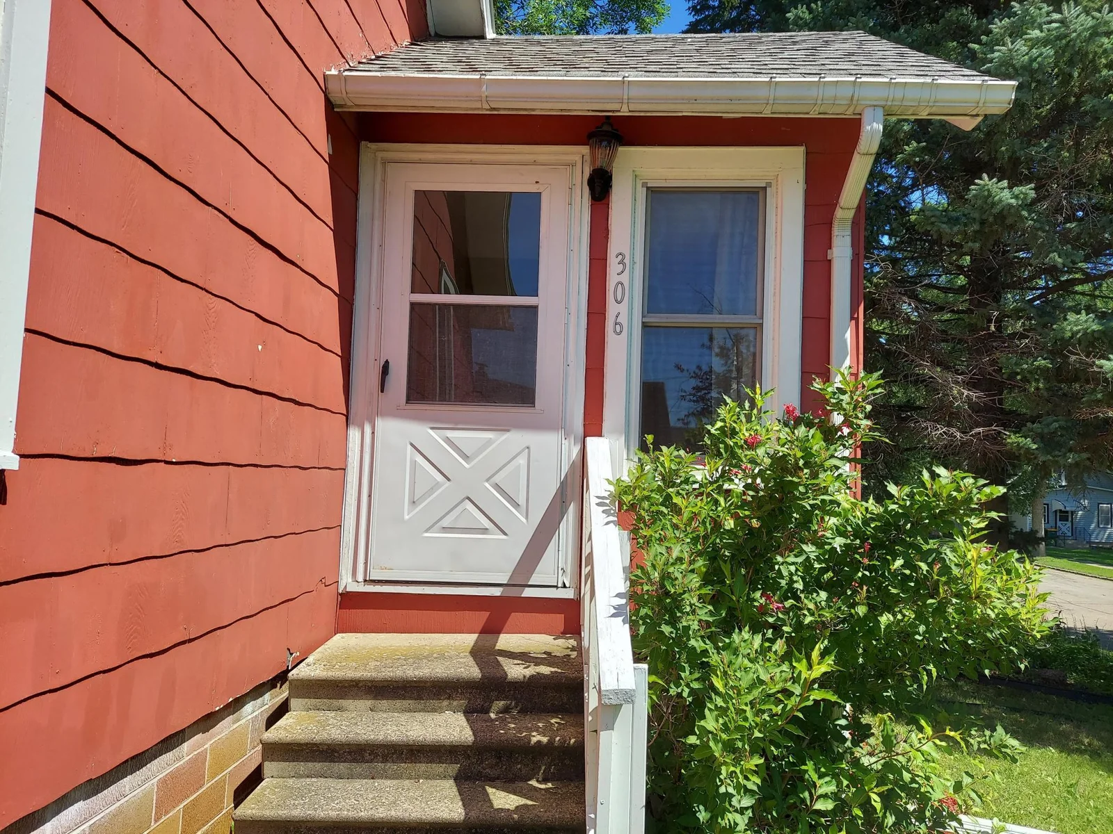Front door leading to porch