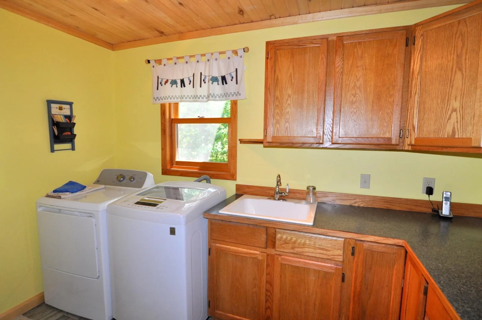 Main floor laundry room with sink