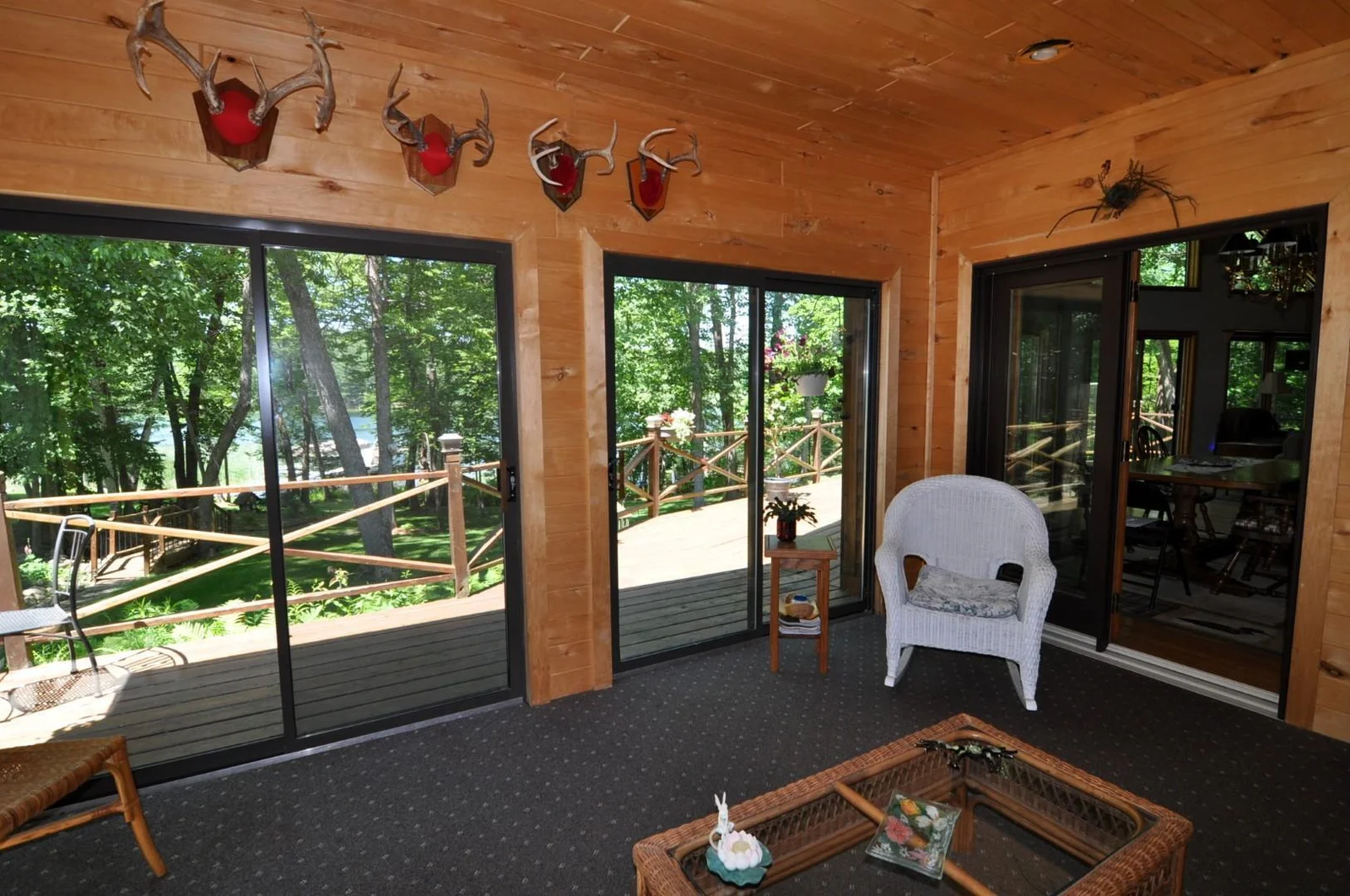 Enjoys the view from inside and out.  Sunroom also accesses the large lakeside deck