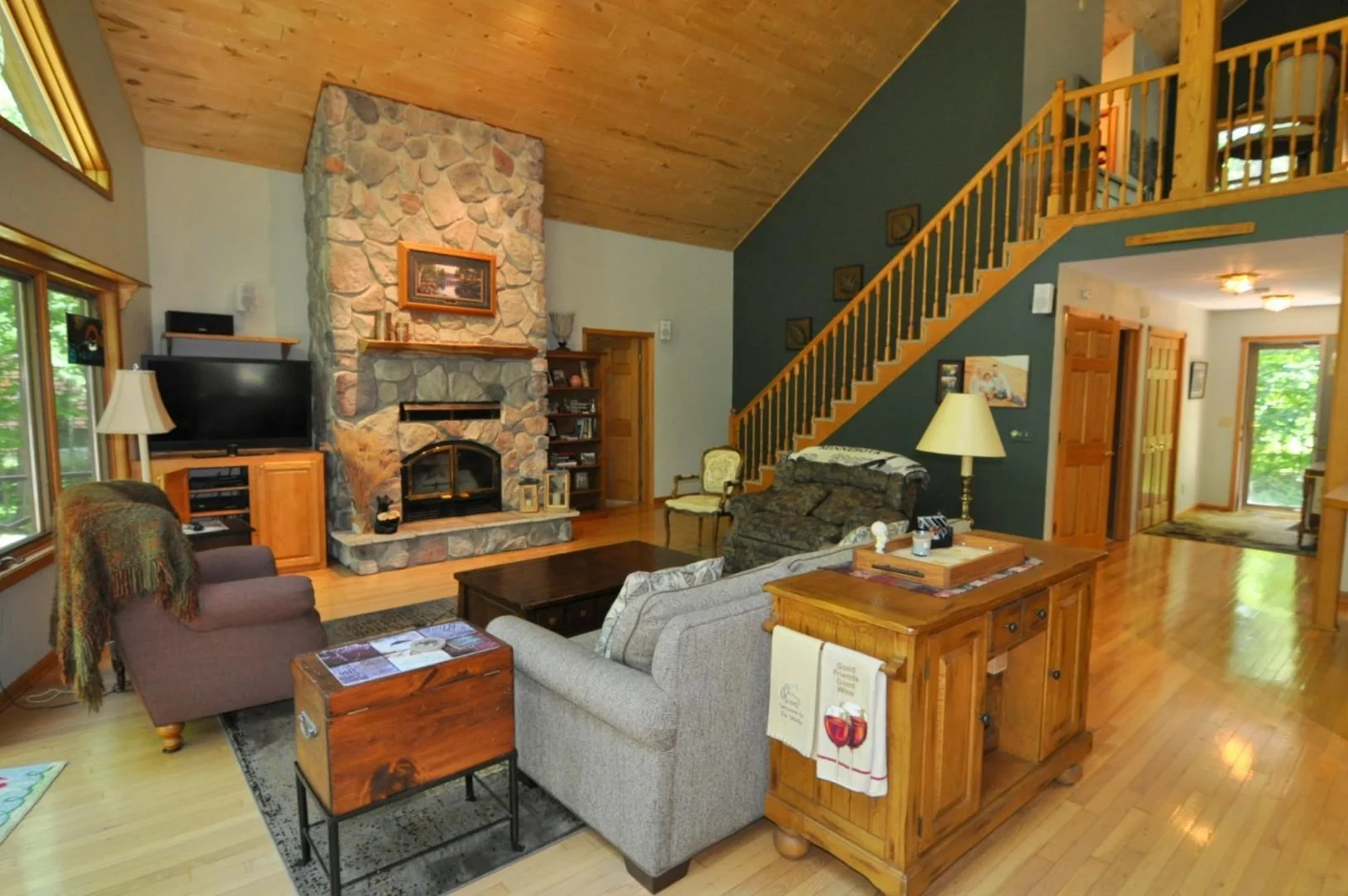Woodburning fireplace, pine T&G ceilings.