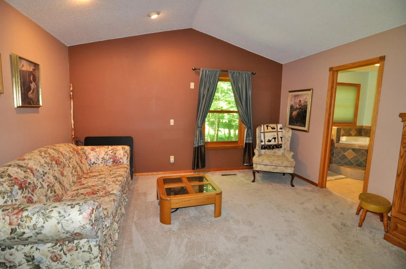 Spacious sitting area within the primary bedroom