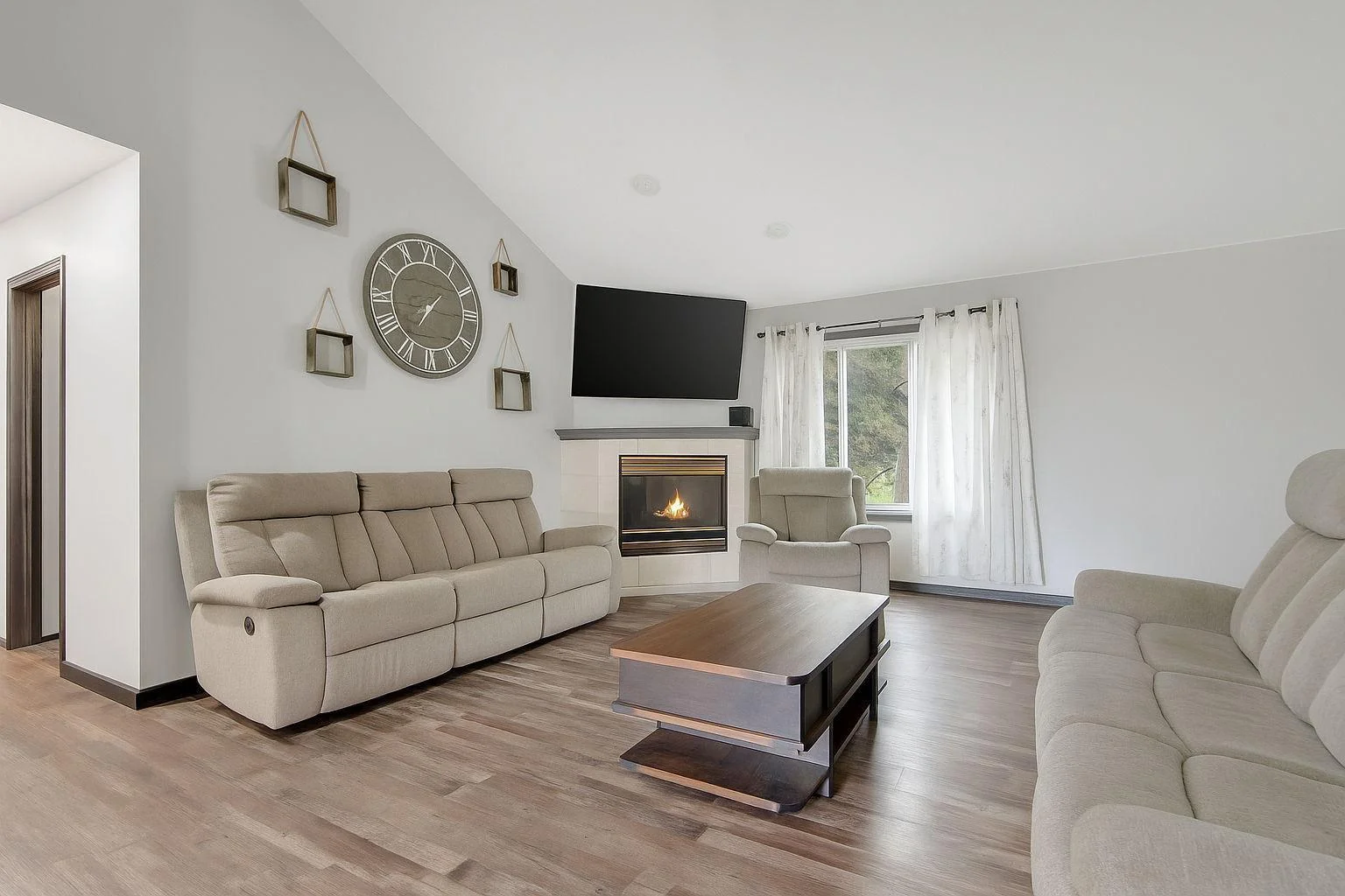 Living room with gas fireplace.  **Photos have been edited to remove personal property**