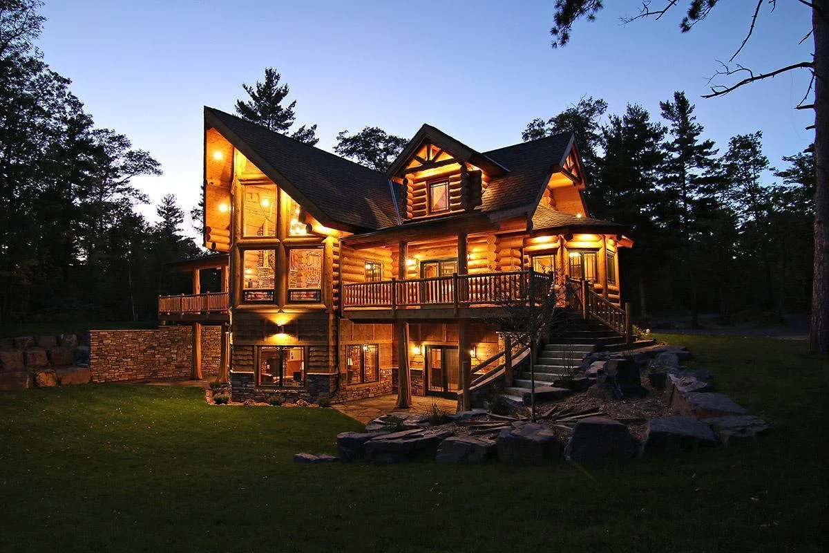Twilight photo of the home looking from the lake